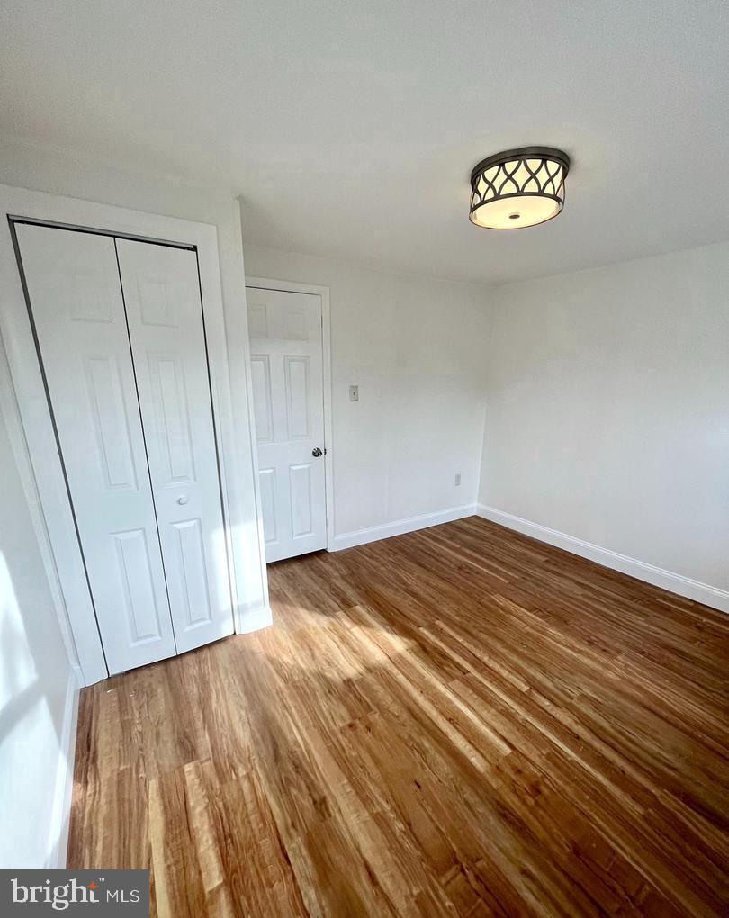119 1/2 Maple Street, Unit 2 Conshohocken, PA 19428 - Photo 22 of 28 a view of empty room with wooden floor