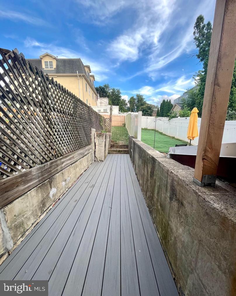 119 1/2 Maple Street, Unit 2 Conshohocken, PA 19428 - Photo 27 of 28 a view of balcony with wooden floor and fence