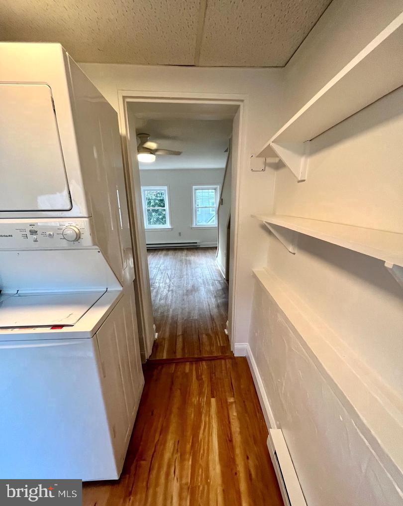 119 1/2 Maple Street, Unit 2 Conshohocken, PA 19428 - Photo 5 of 28 a view of a hallway view with wooden floor and staircase