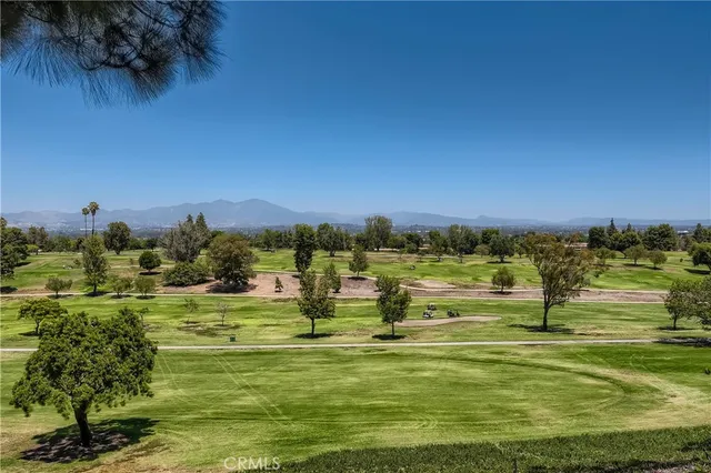 a view of a lake with houses in the back