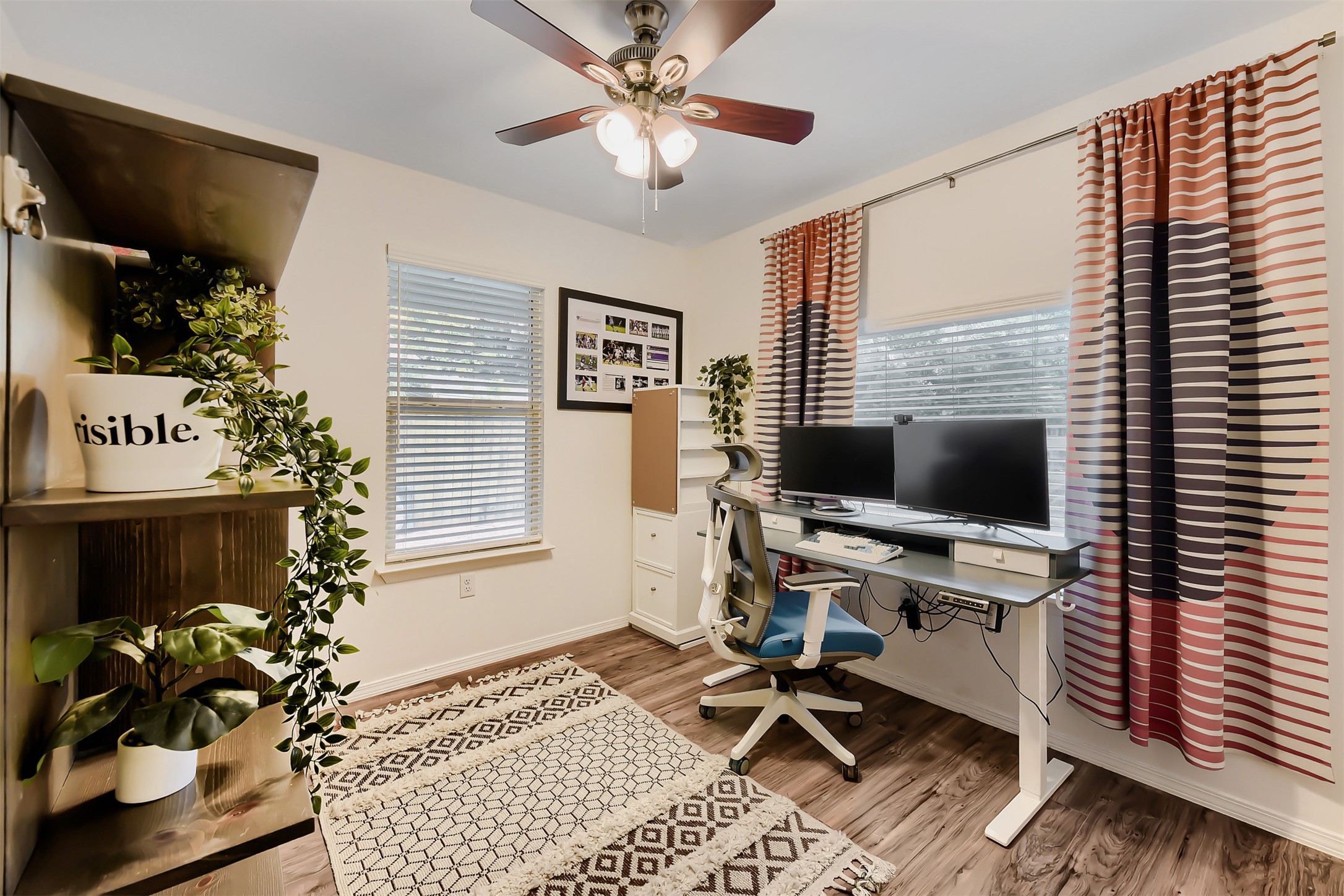 6105 Palm Circle Austin, TX 78741 - Photo 13 of 29 a workspace with furniture and a flat screen tv