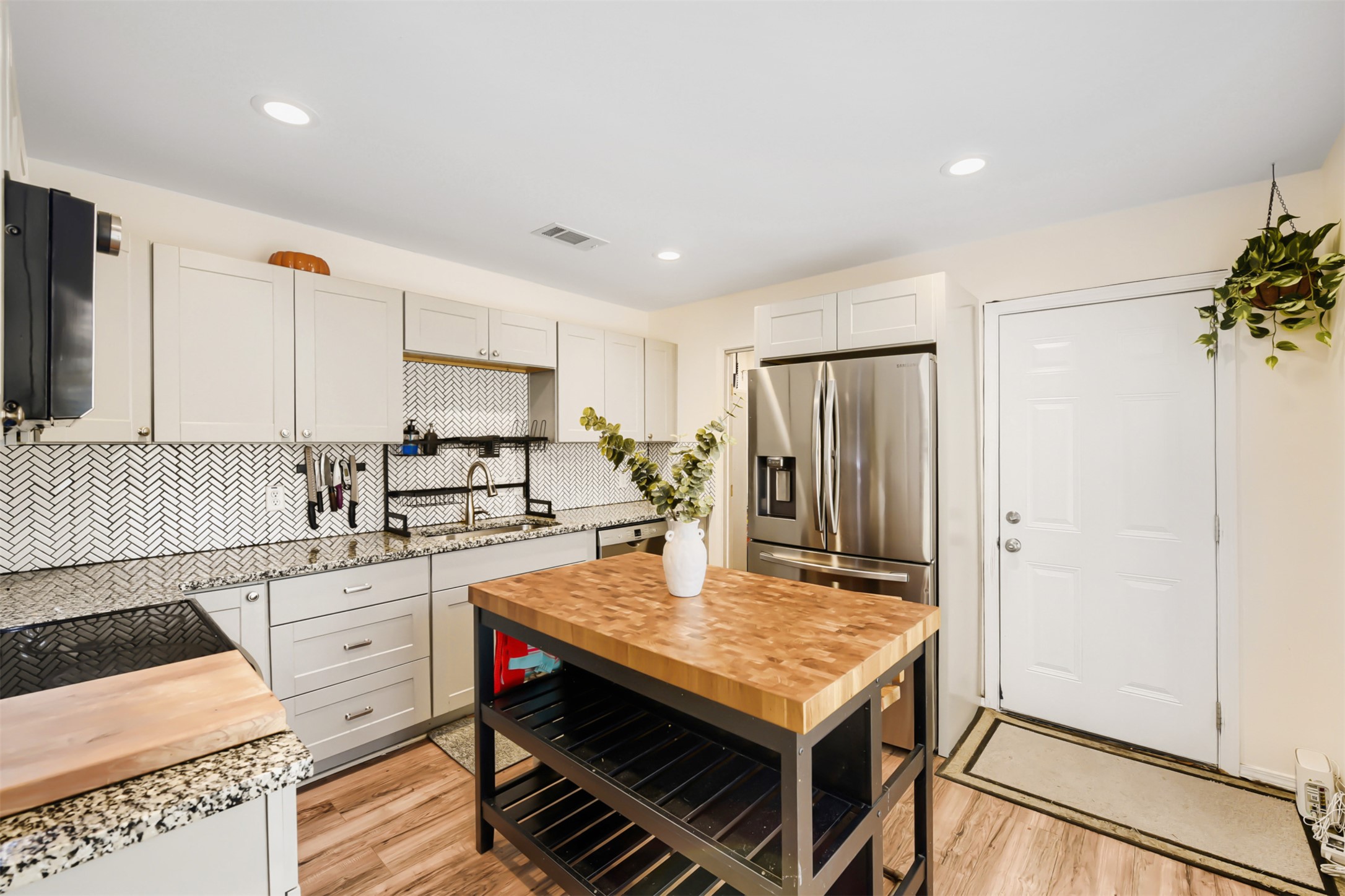 6105 Palm Circle Austin, TX 78741 - Photo 14 of 29 a kitchen with a stove and a refrigerator