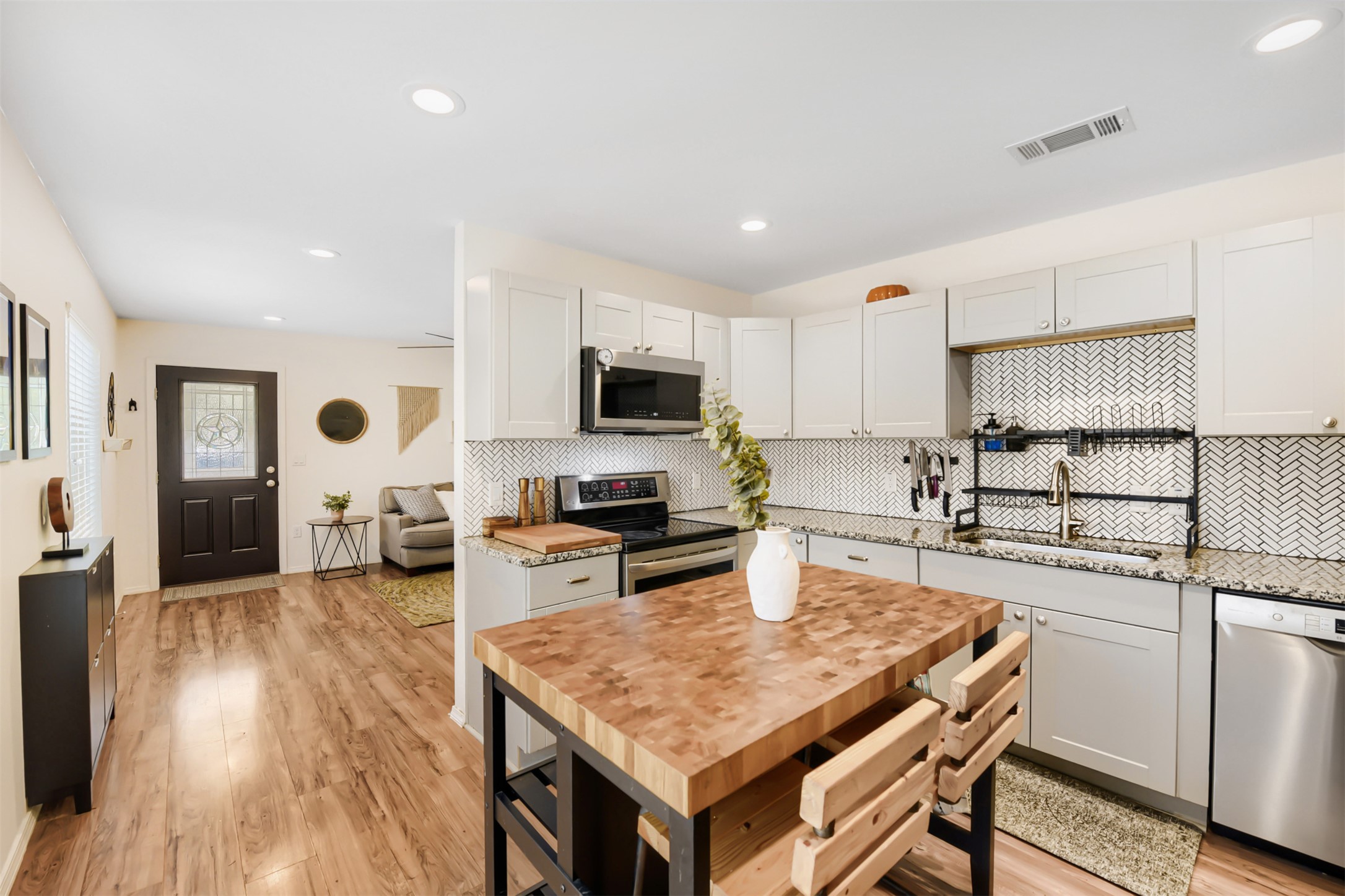 6105 Palm Circle Austin, TX 78741 - Photo 15 of 29 a kitchen with white cabinets and appliances