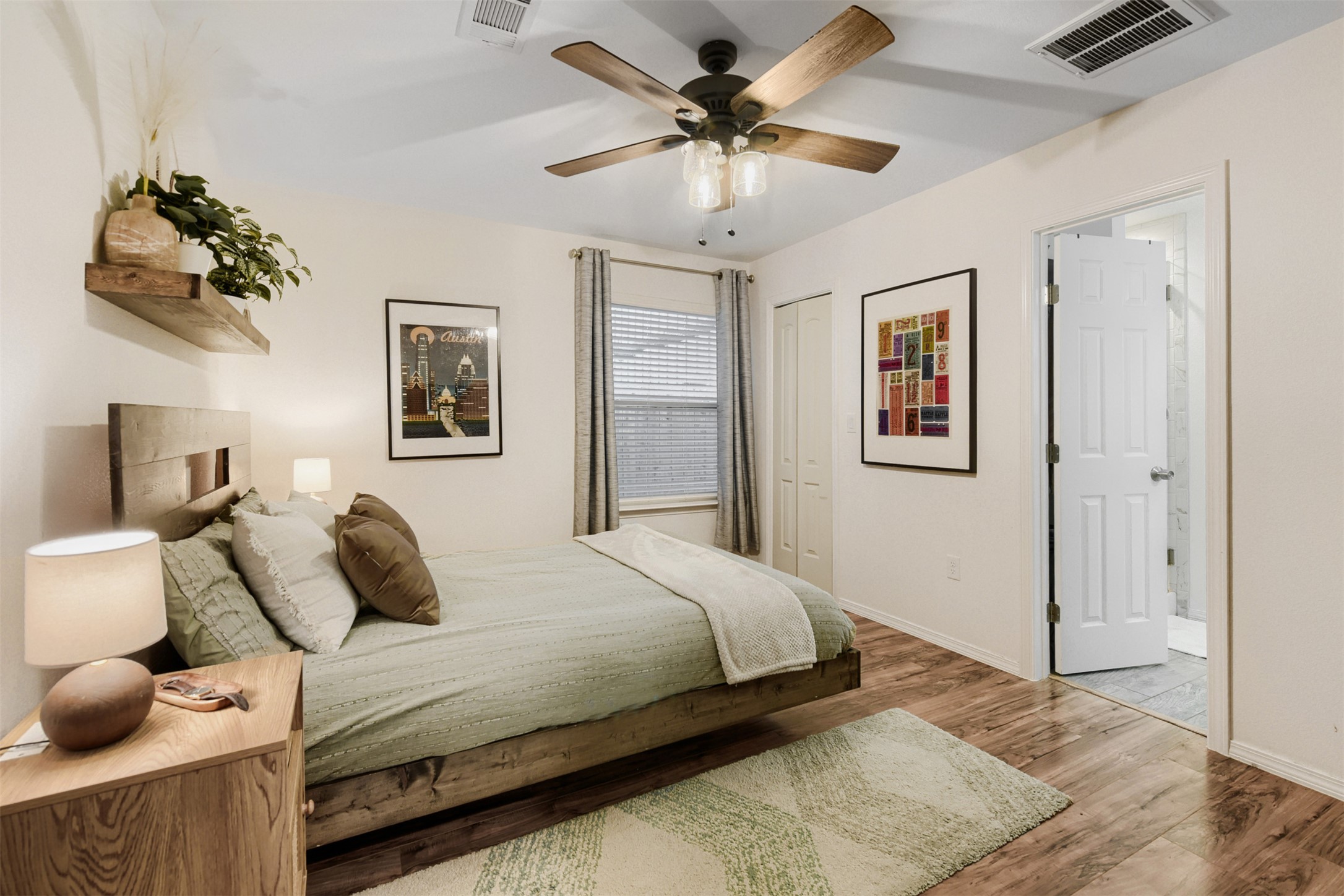 6105 Palm Circle Austin, TX 78741 - Photo 17 of 29 a bedroom with a bed and a chandelier