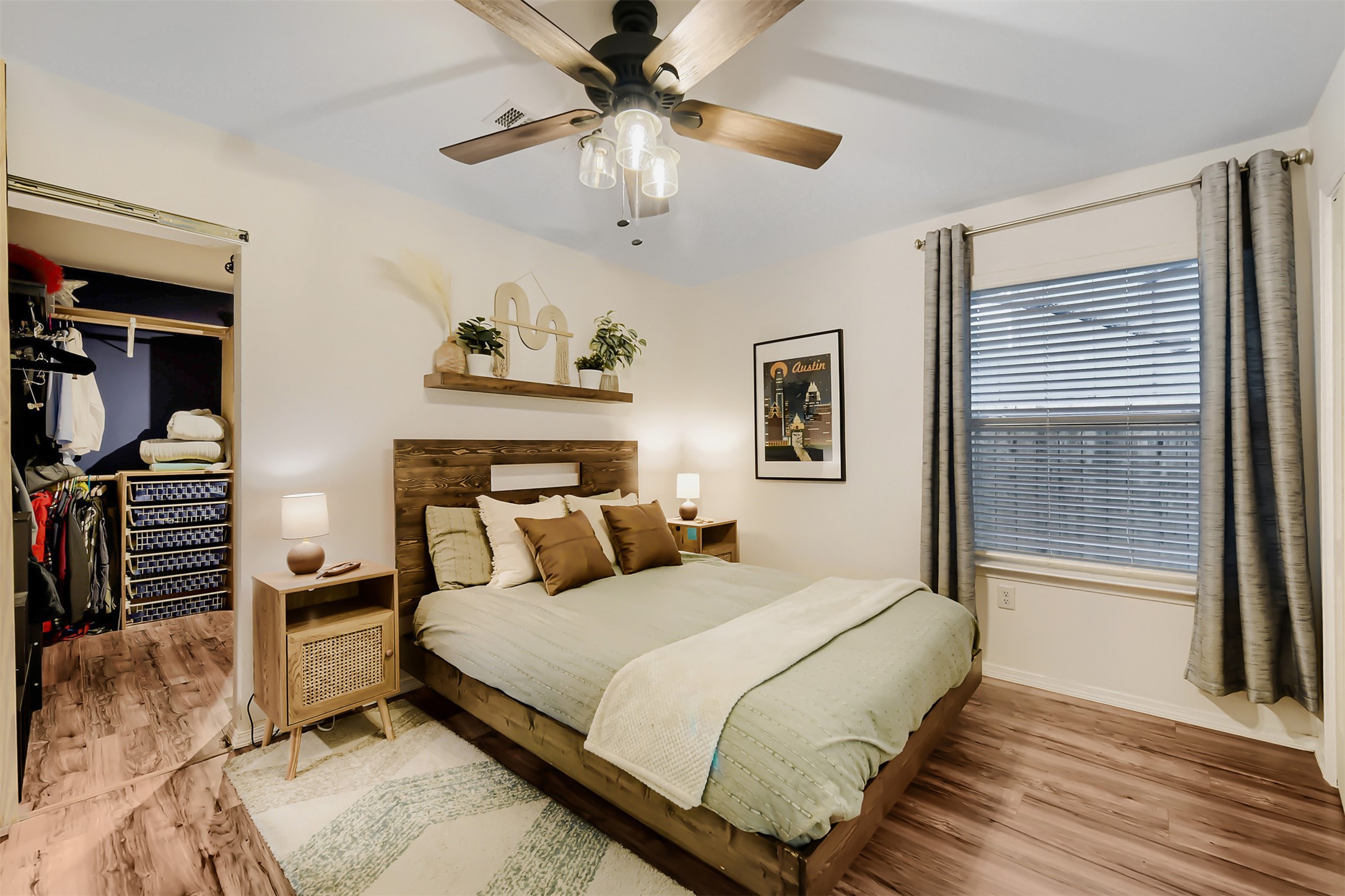 6105 Palm Circle Austin, TX 78741 - Photo 18 of 29 a bedroom with a bed and a chandelier
