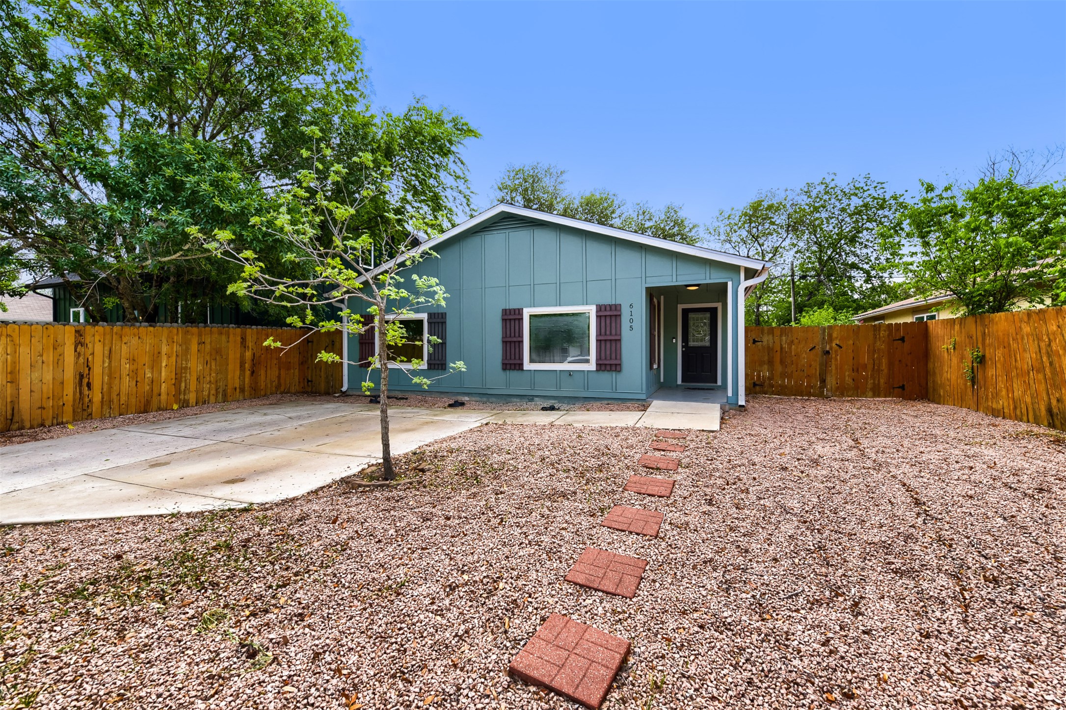6105 Palm Circle Austin, TX 78741 - Photo 2 of 29 a house with trees in the background