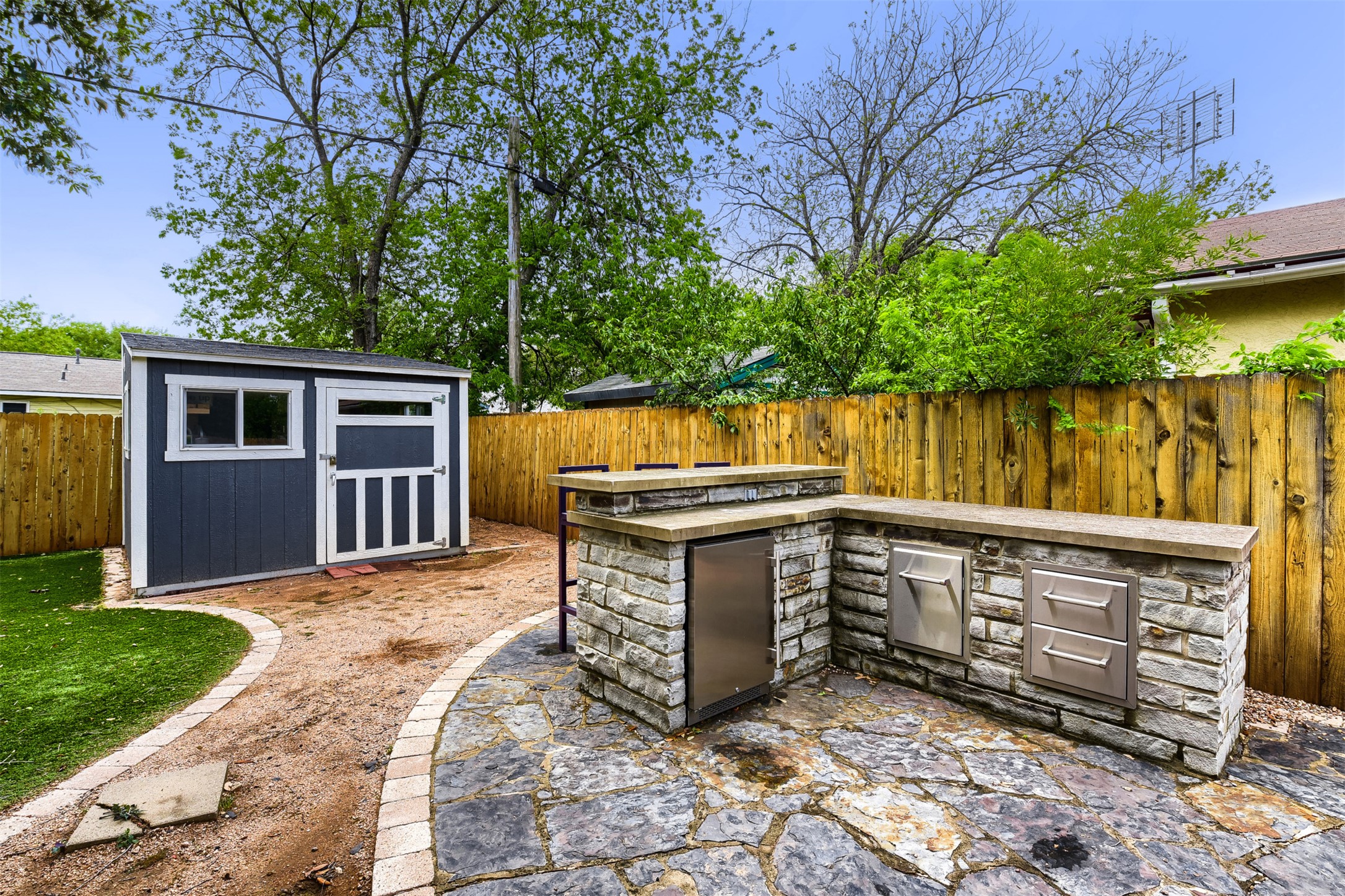 6105 Palm Circle Austin, TX 78741 - Photo 22 of 29 a view of house with backyard outdoor seating and barbeque oven