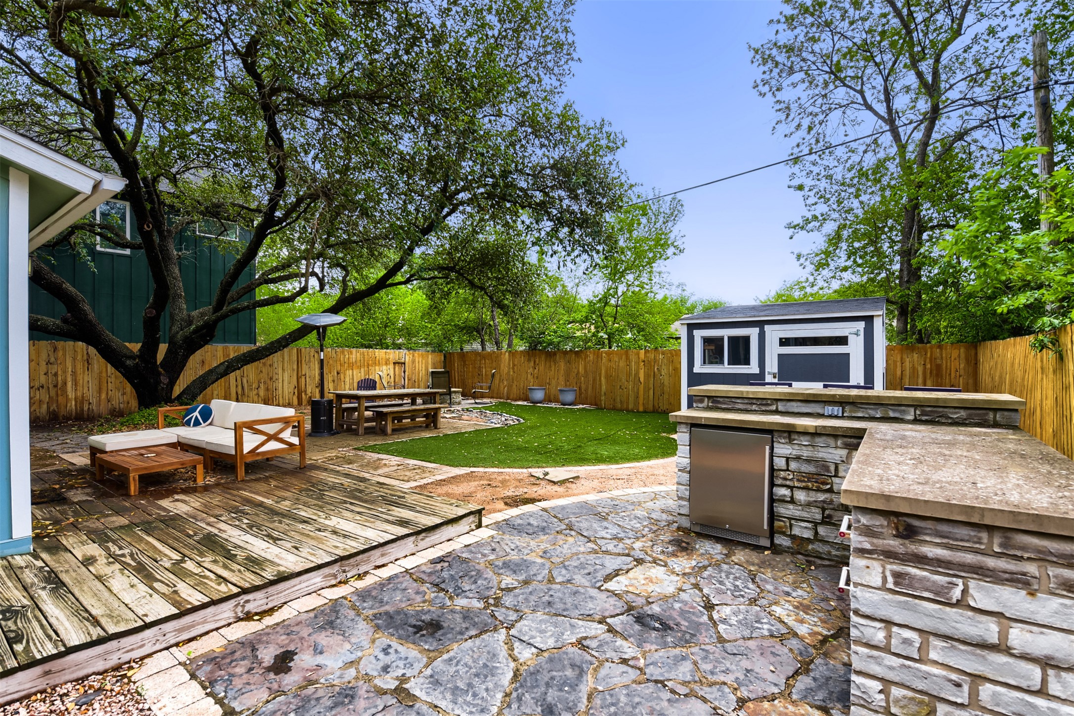 6105 Palm Circle Austin, TX 78741 - Photo 23 of 29 a view of a patio with a table and chairs under an umbrella