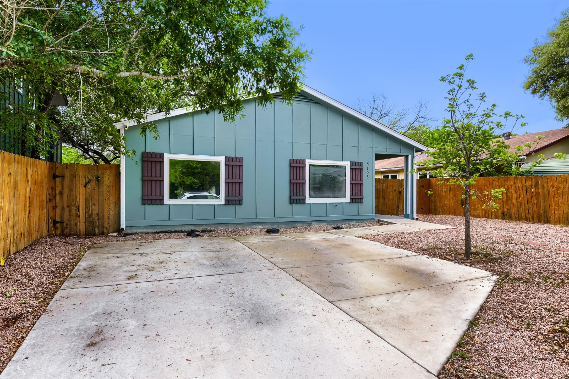 6105 Palm Circle Austin, TX 78741 - Photo 3 of 29 a view of a house with a backyard and tree