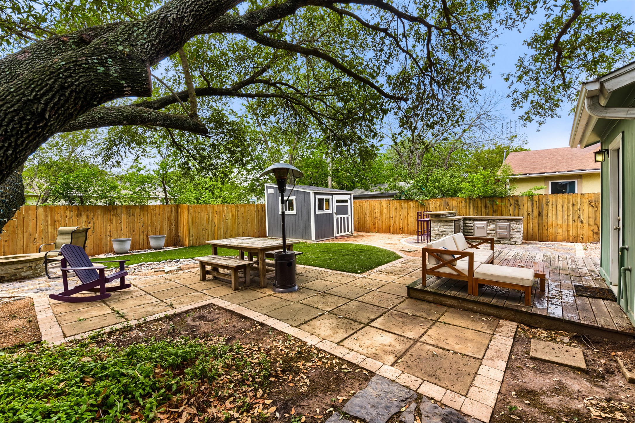 6105 Palm Circle Austin, TX 78741 - Photo 4 of 29 a backyard of a house with barbeque oven fire pit table and chairs