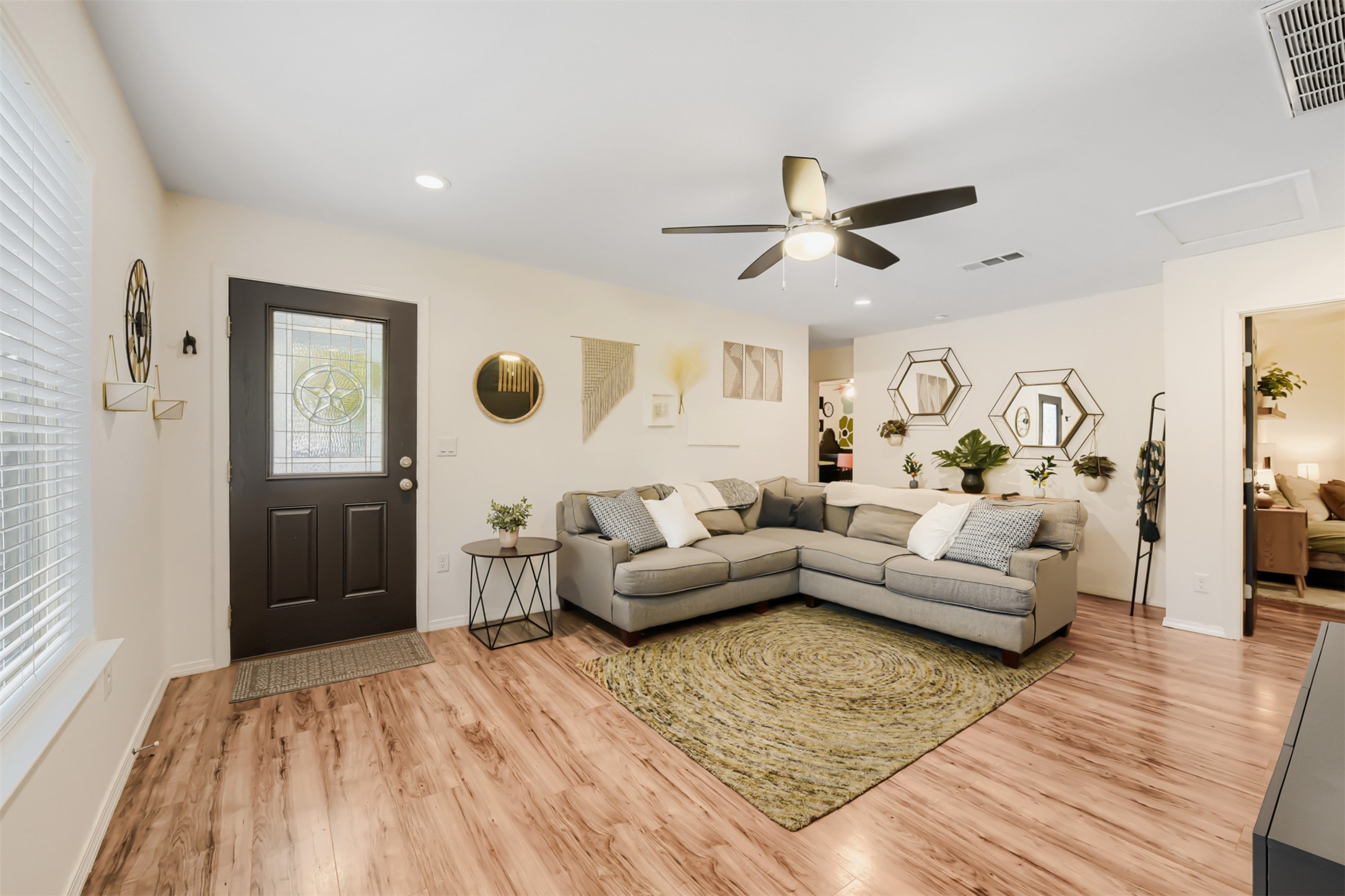 6105 Palm Circle Austin, TX 78741 - Photo 8 of 29 a living room with furniture and a wooden floor