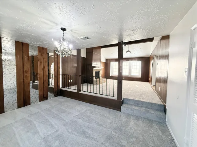 a view of an entryway with a chandelier