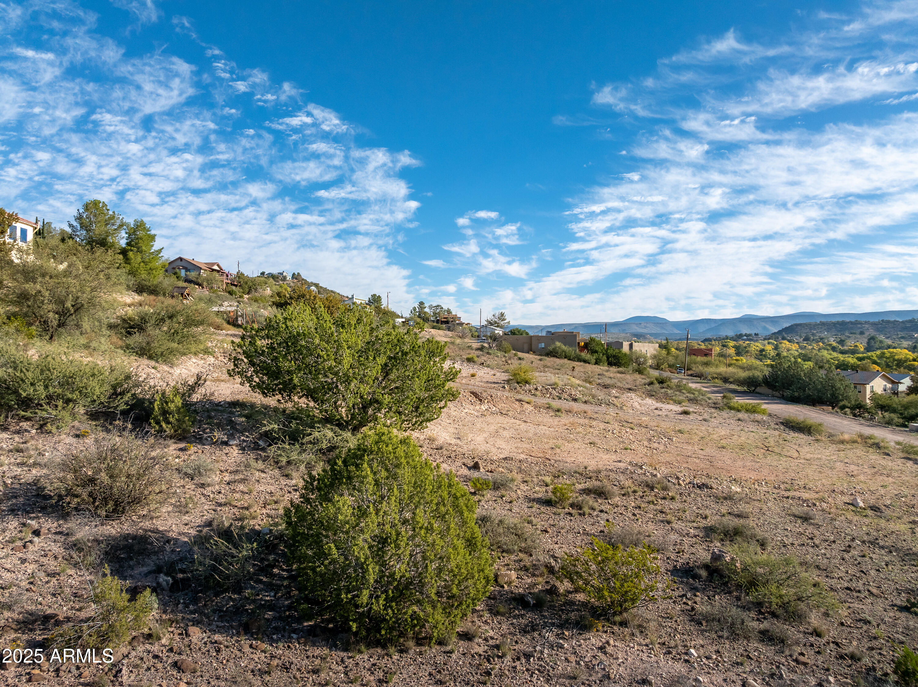 3455 Rusty Spurs Road, Unit 63 Rimrock, AZ 86335 - Photo 15 of 29 a view of a lake with mountains in the background