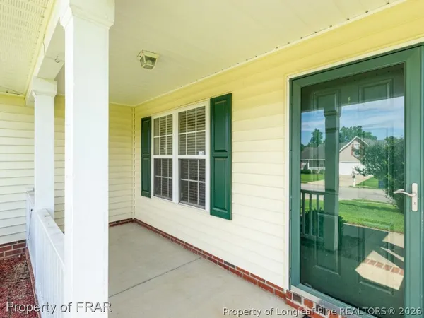 a view of a porch of a house
