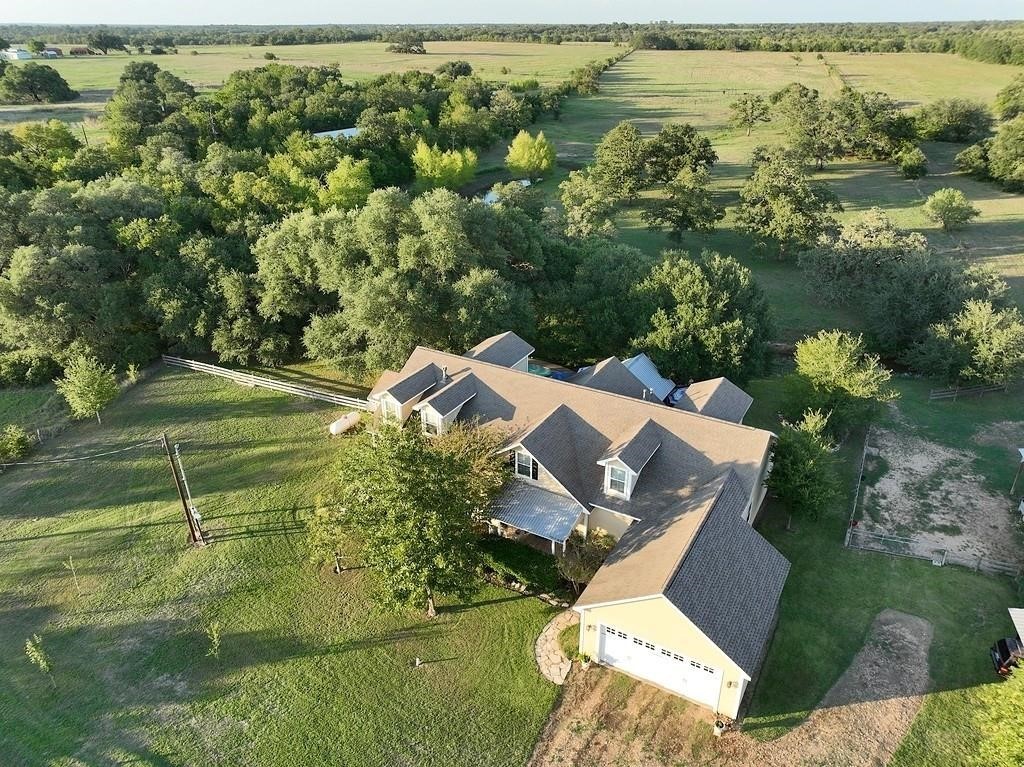 8456 Schuster Road Ledbetter, TX 78946 - Photo 3 of 49 an aerial view of a house with a yard and lake view