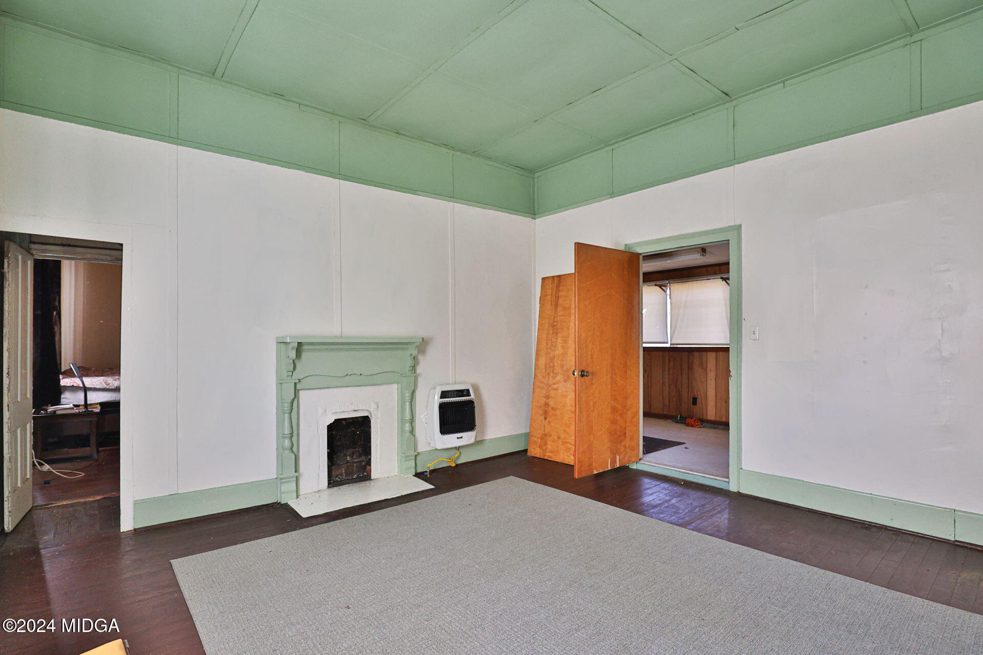 100 Minor Avenue Montezuma, GA 31063 - Photo 17 of 19 a view of empty room with a fireplace and cabinet