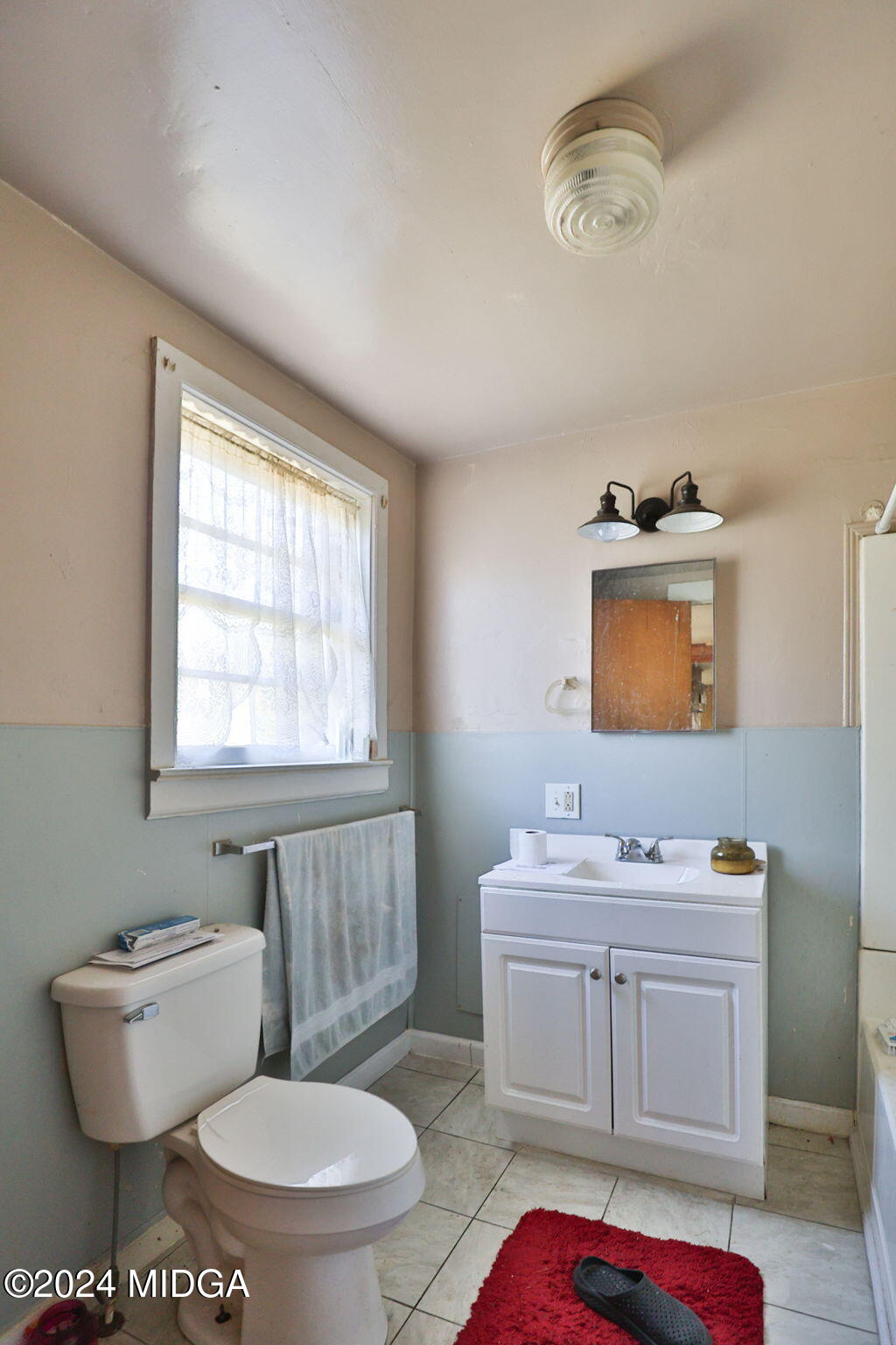 100 Minor Avenue Montezuma, GA 31063 - Photo 19 of 19 a bathroom with a toilet a sink and a mirror