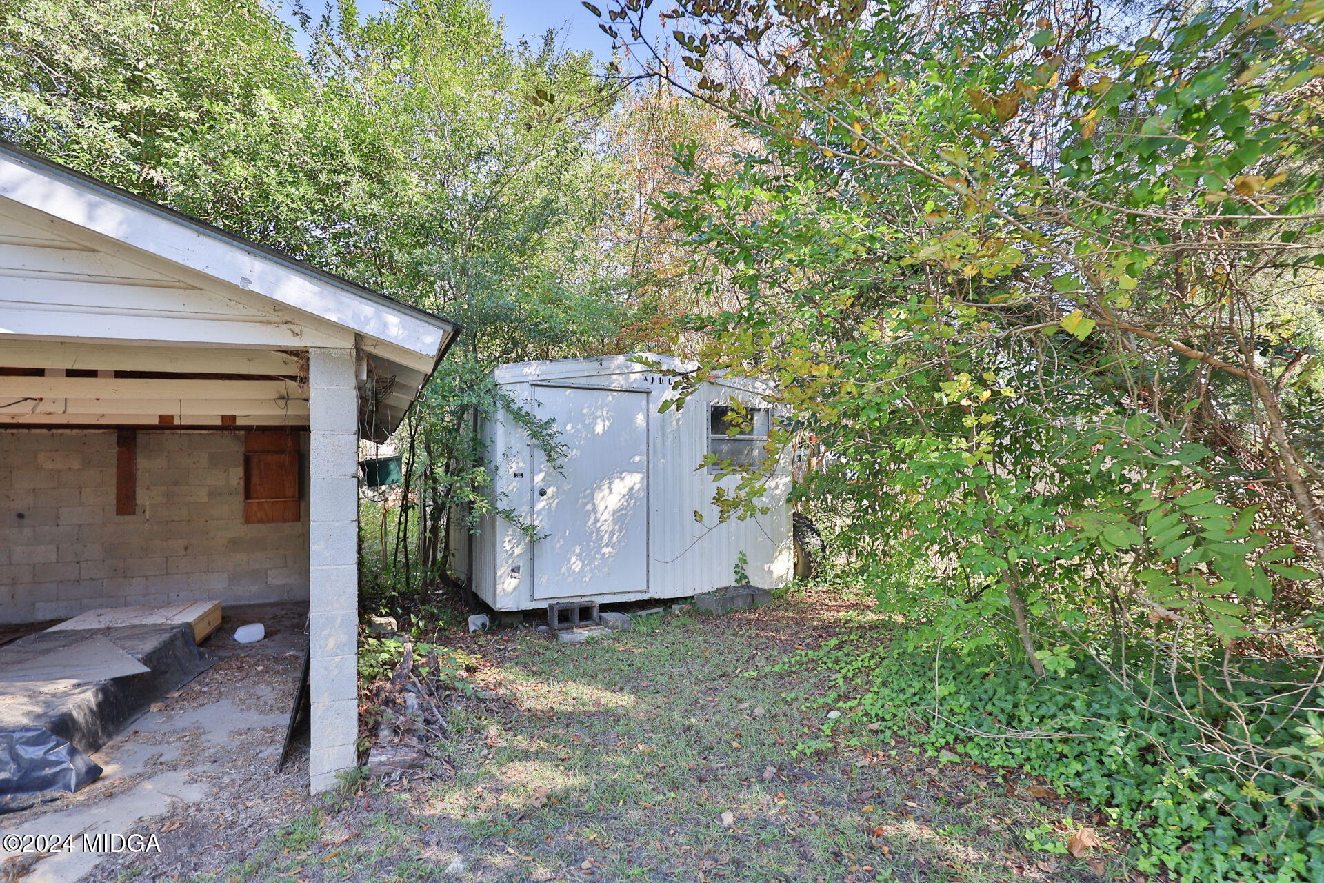 100 Minor Avenue Montezuma, GA 31063 - Photo 7 of 19 a view of a barn in the yard