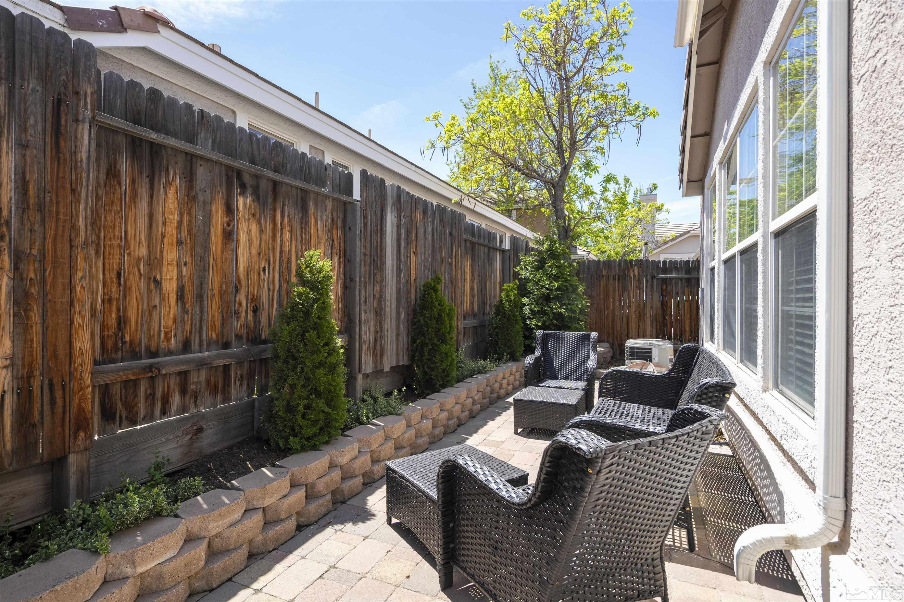 1236 Tule Drive Reno, NV 89521 - Photo 20 of 31 a view of backyard with outdoor seating and green space