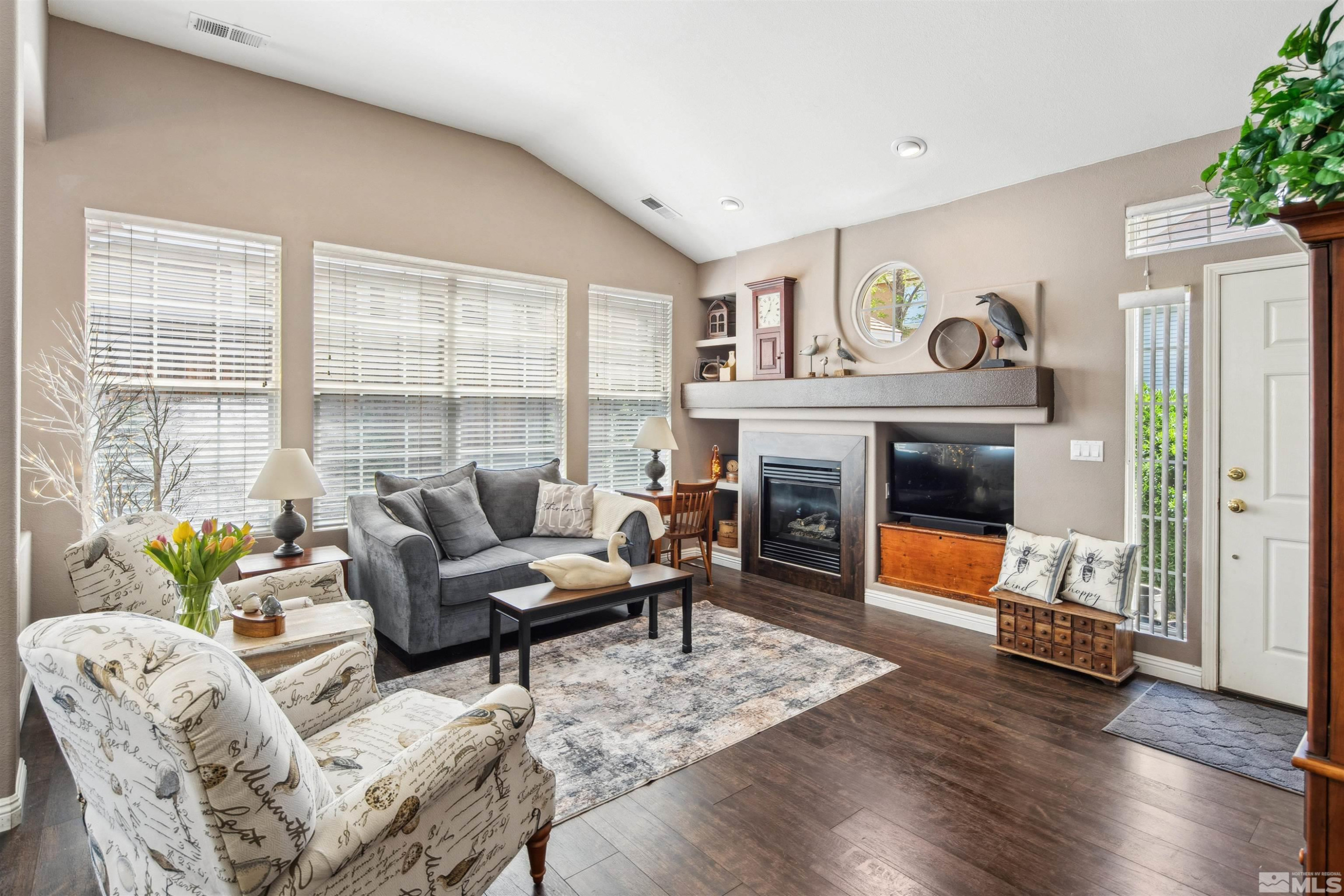 1236 Tule Drive Reno, NV 89521 - Photo 2 of 31 a living room with furniture and a fireplace