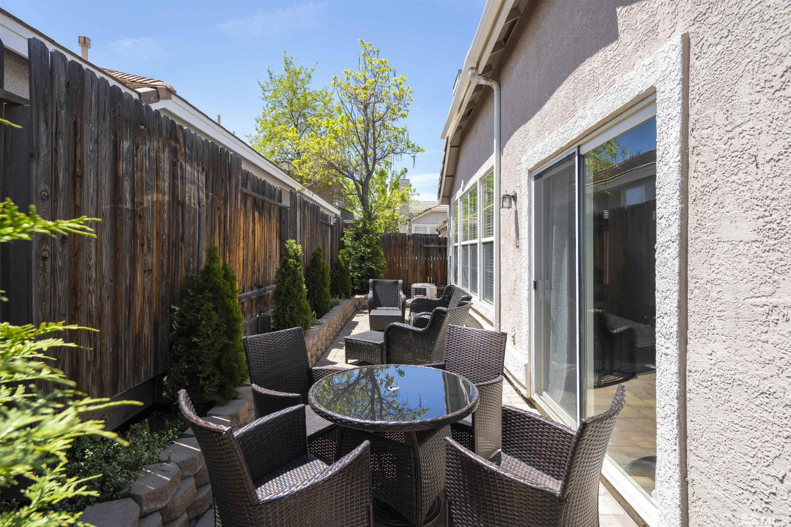 1236 Tule Drive Reno, NV 89521 - Photo 21 of 31 a backyard of a house with outdoor seating