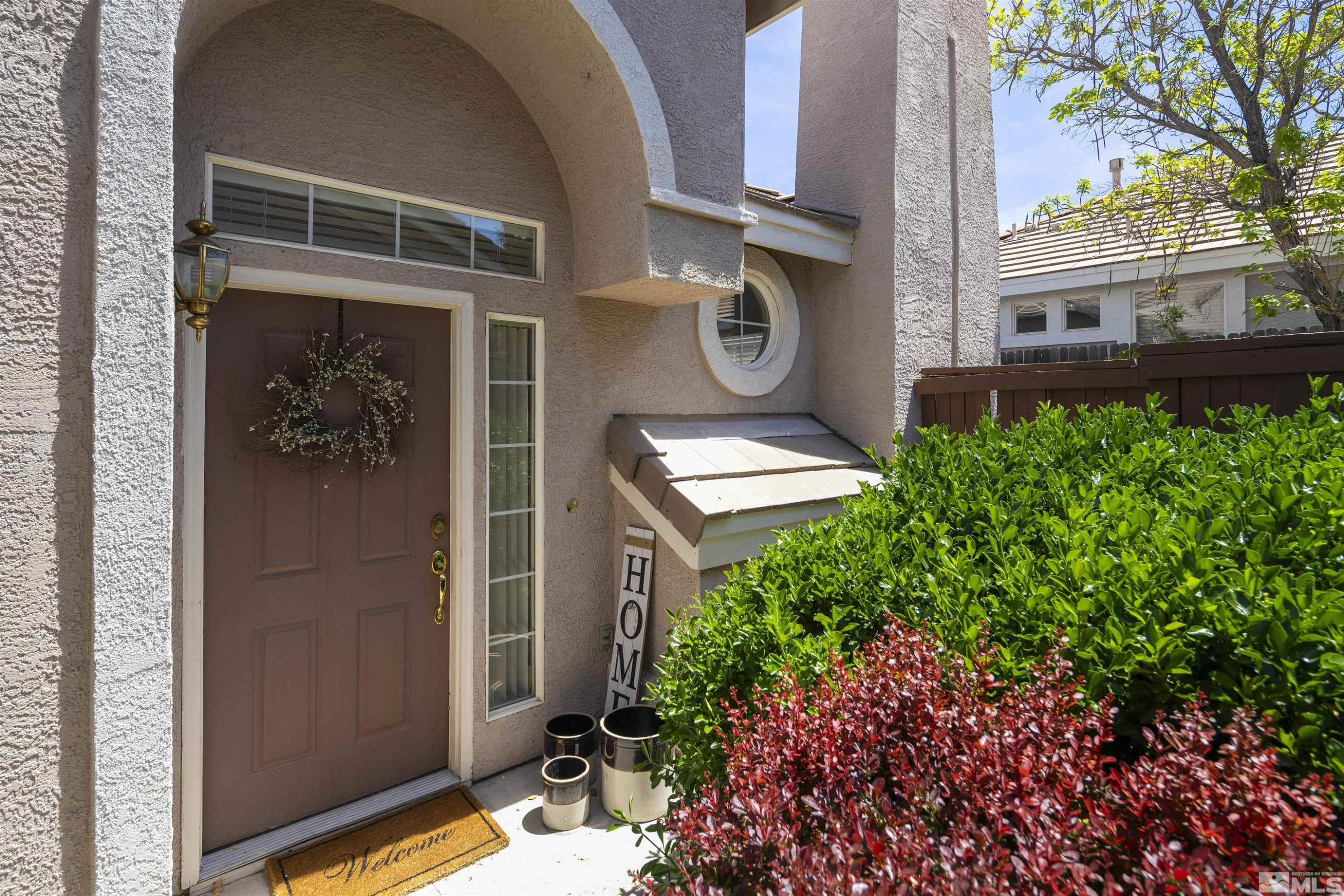 1236 Tule Drive Reno, NV 89521 - Photo 25 of 31 a front view of a house with a yard
