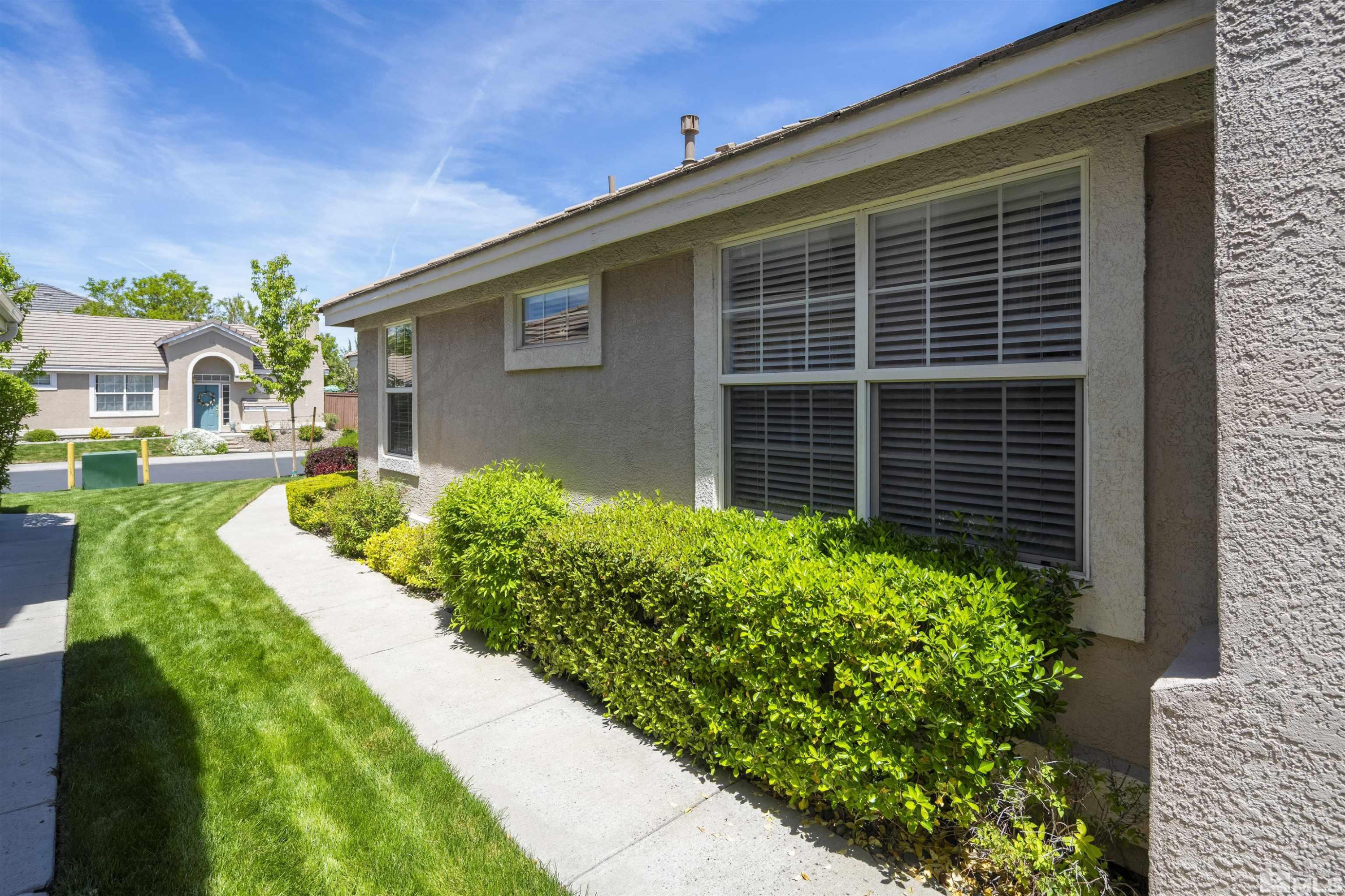 1236 Tule Drive Reno, NV 89521 - Photo 26 of 31 a front view of a house with garden