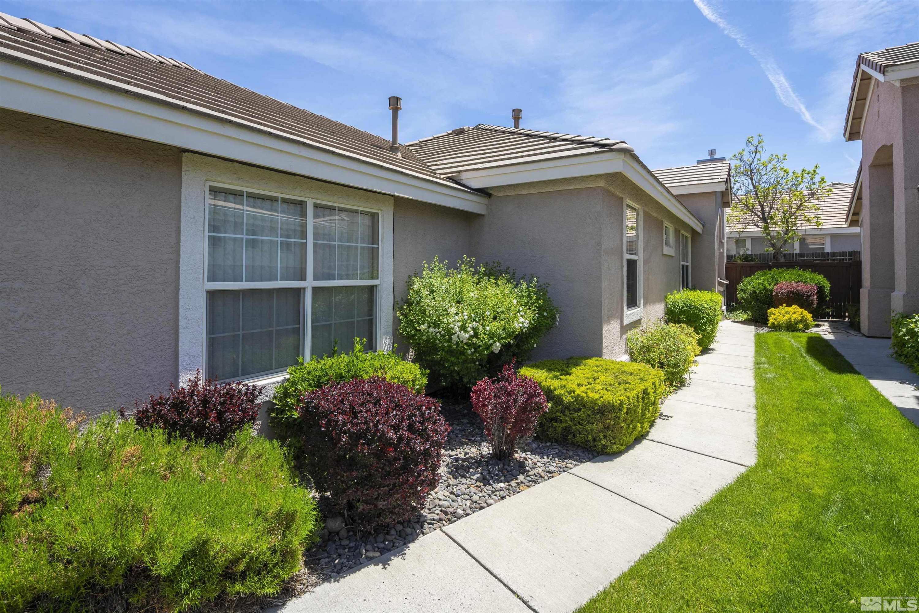 1236 Tule Drive Reno, NV 89521 - Photo 27 of 31 a front view of a house with a yard