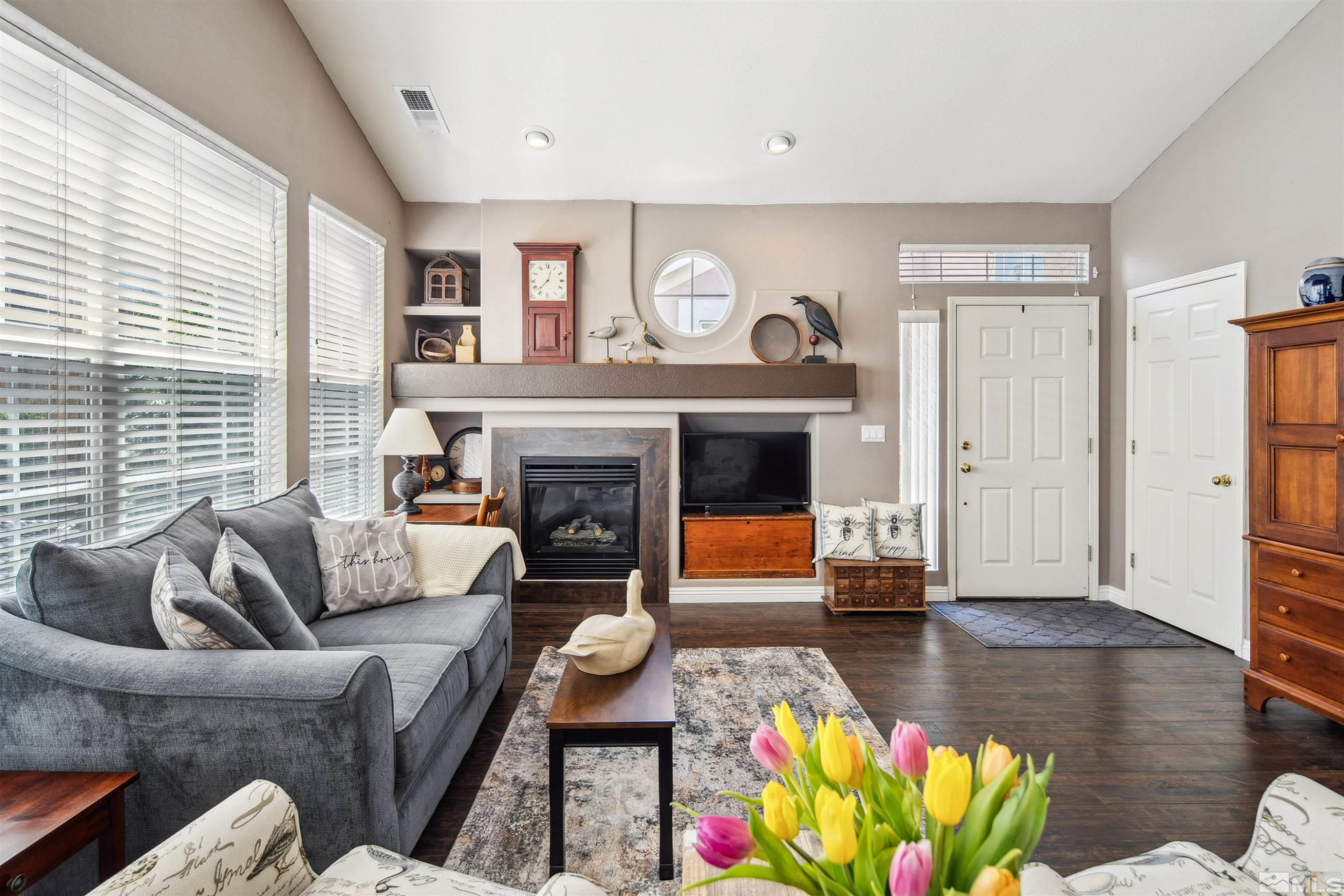 1236 Tule Drive Reno, NV 89521 - Photo 3 of 31 a living room with furniture and a fireplace