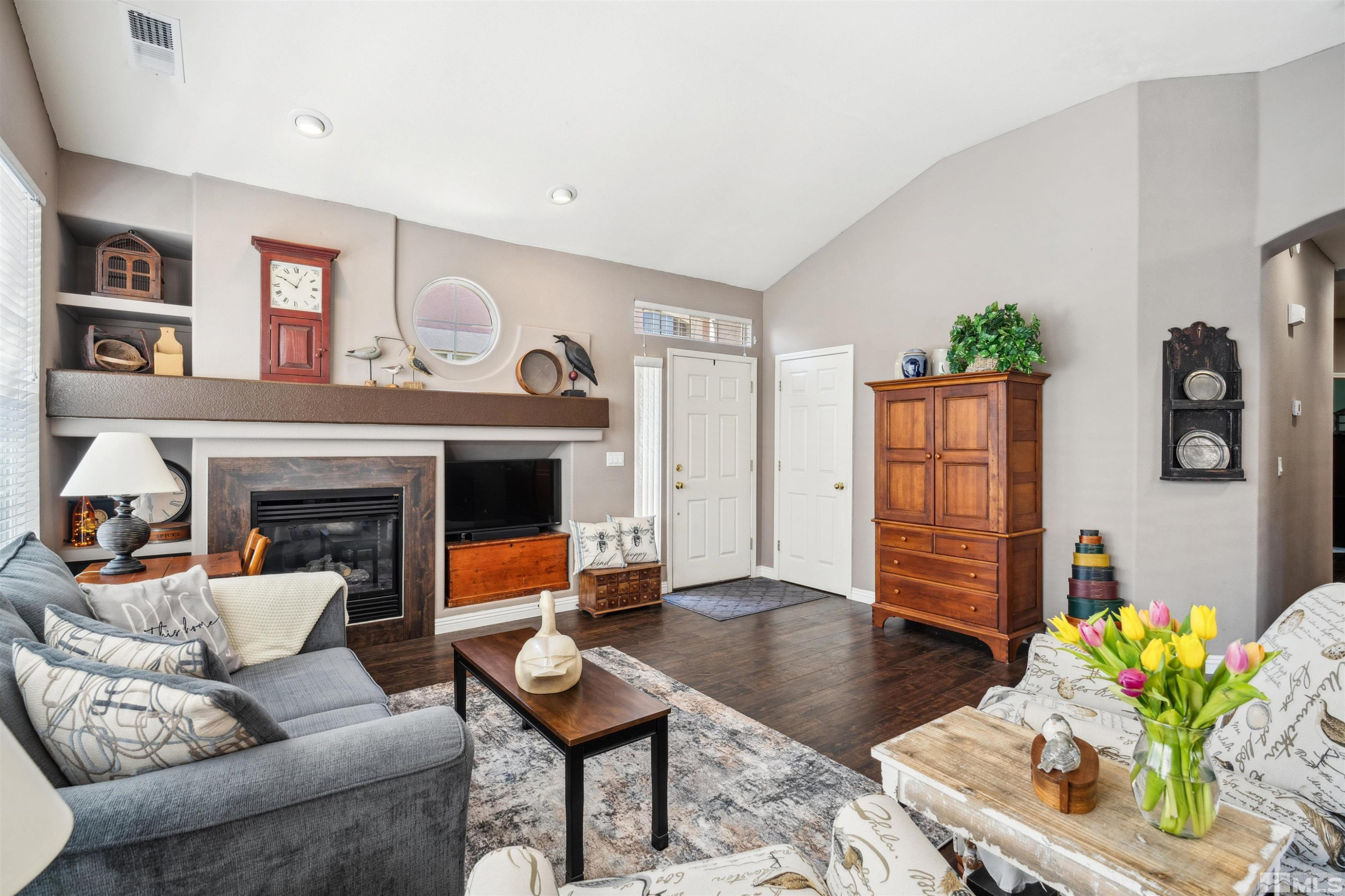 1236 Tule Drive Reno, NV 89521 - Photo 4 of 31 a living room with furniture and a fireplace