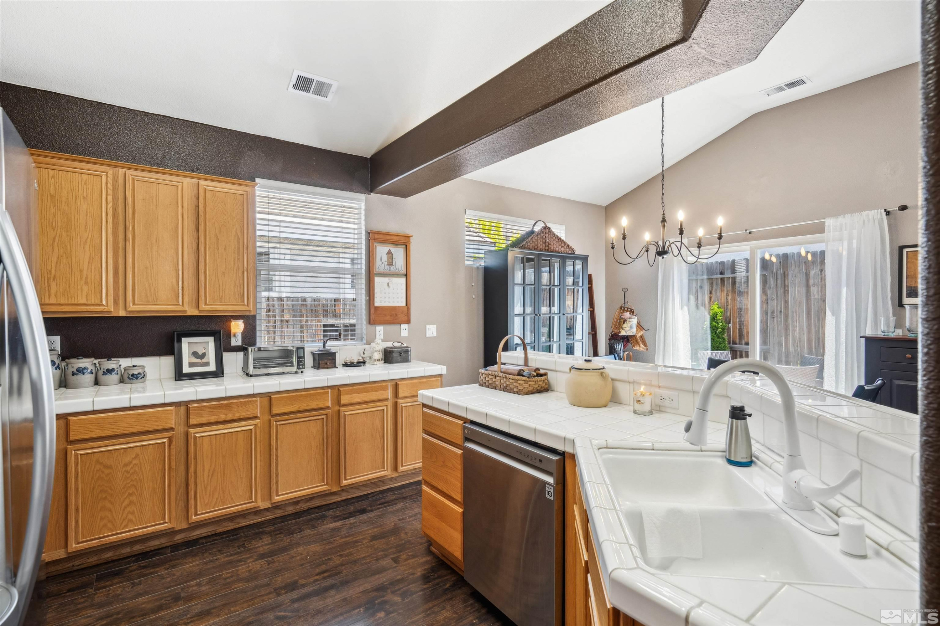 1236 Tule Drive Reno, NV 89521 - Photo 7 of 31 a kitchen with a sink stove and cabinets