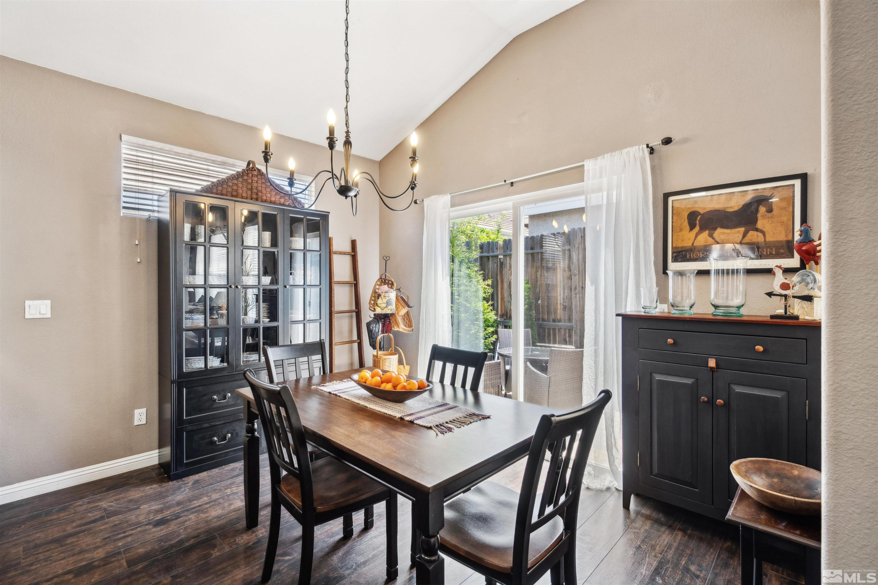 1236 Tule Drive Reno, NV 89521 - Photo 9 of 31 a view of a dining room with furniture window and wooden floor