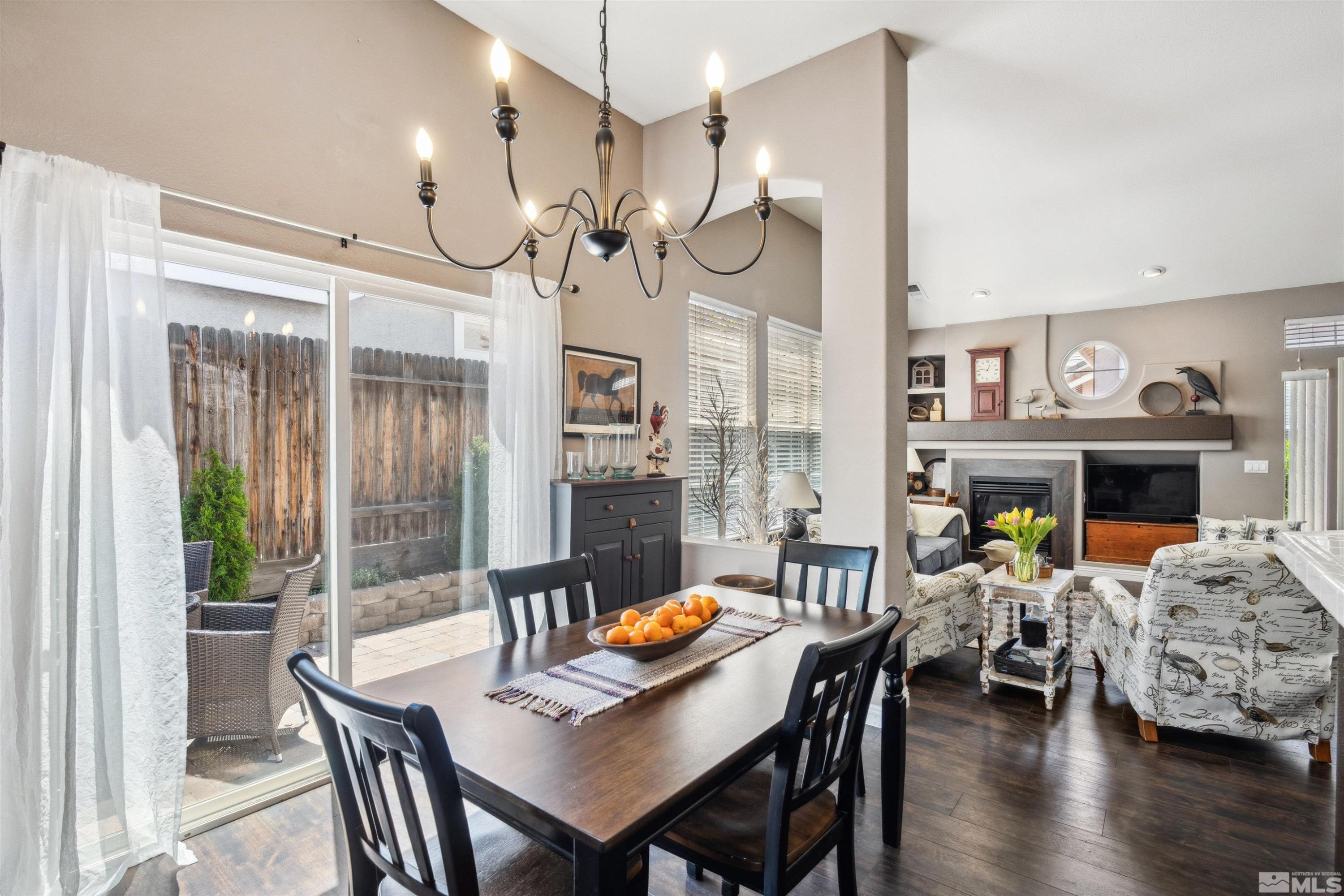1236 Tule Drive Reno, NV 89521 - Photo 10 of 31 a view of a dining room with furniture window and wooden floor