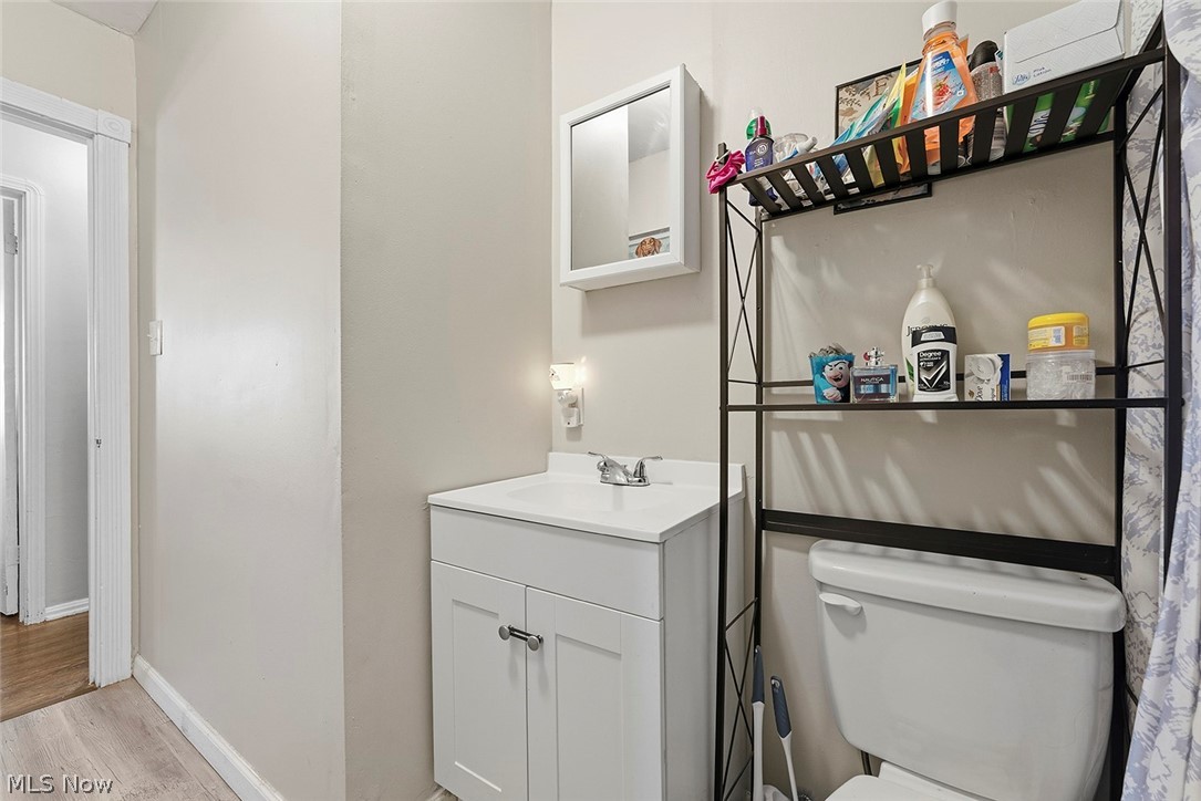 5615 Snow Road Parma, OH 44129 - Photo 17 of 39 Half bath featuring vanity and light wood finished floors