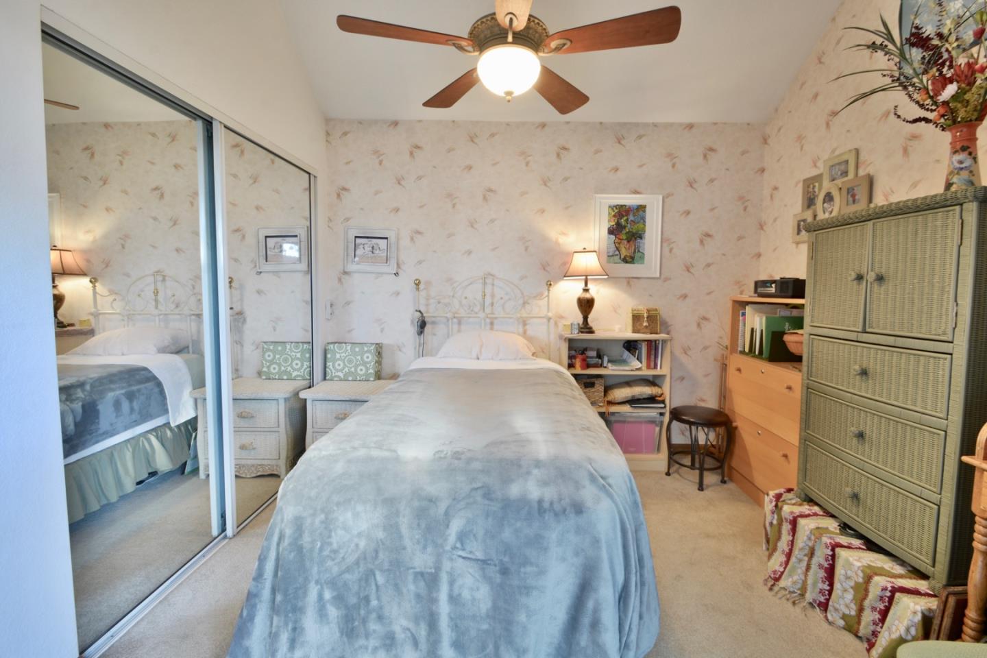 738 Natalie Drive Morgan Hill, CA 95037 - Photo 25 of 37 a large bedroom with a bed and wooden floor