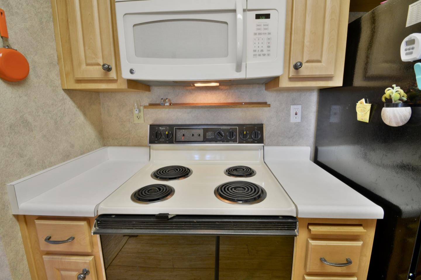 738 Natalie Drive Morgan Hill, CA 95037 - Photo 10 of 37 a kitchen with a stove and a microwave