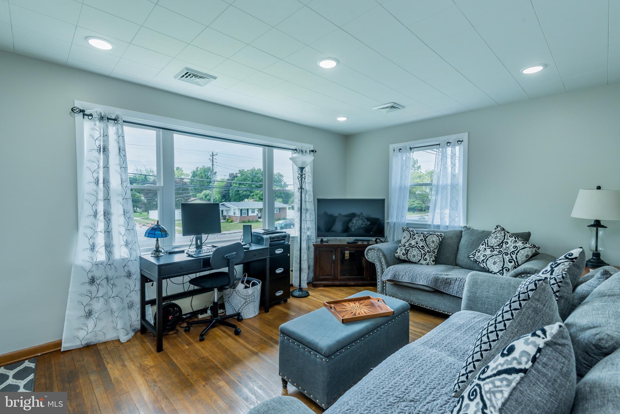 3518 Trindle Road, Unit 1 Camp Hill, PA 17011 - Photo 2 of 14 a living room with furniture and a wooden floor