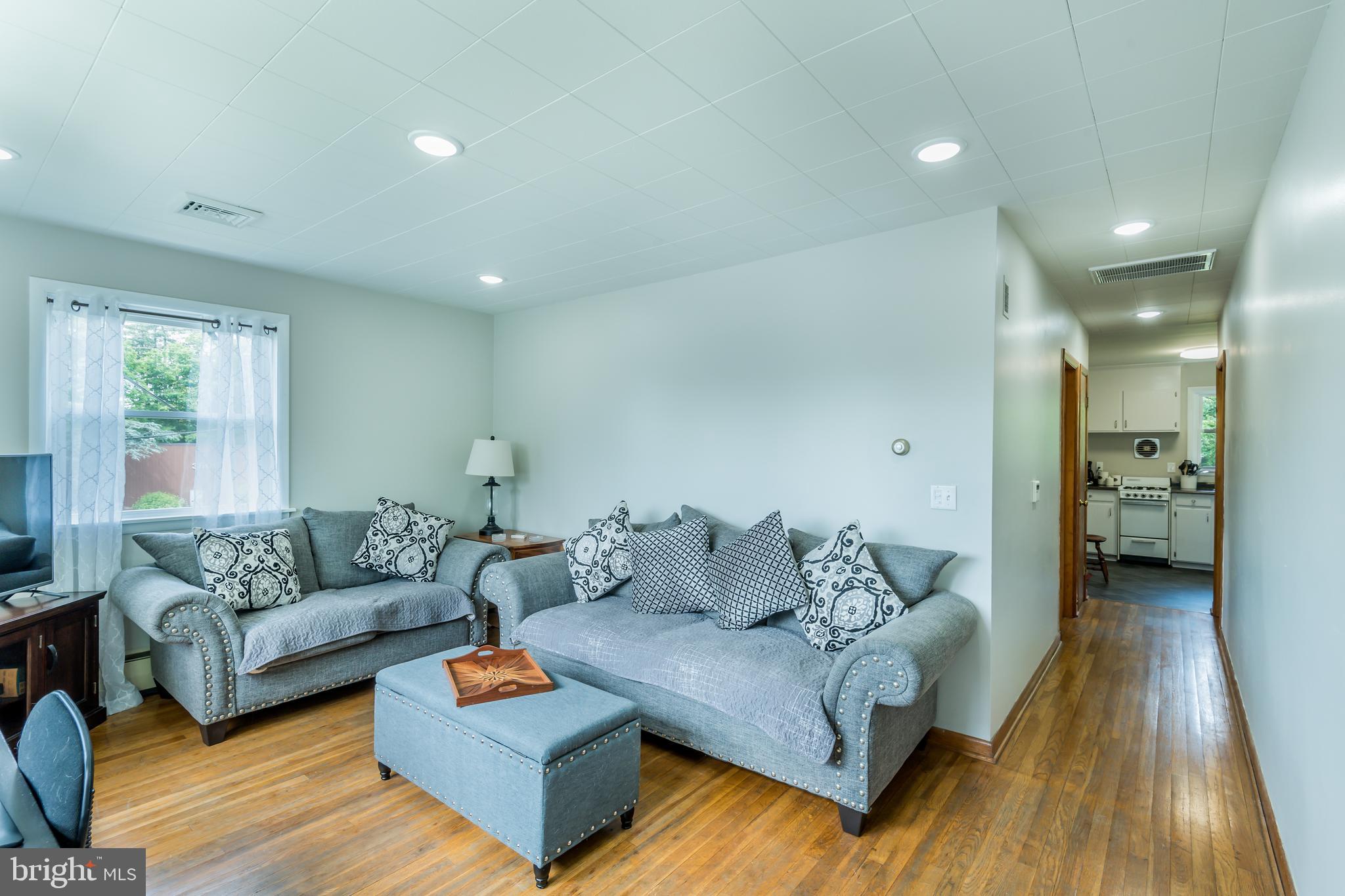 3518 Trindle Road, Unit 1 Camp Hill, PA 17011 - Photo 3 of 14 a living room with furniture and a couch