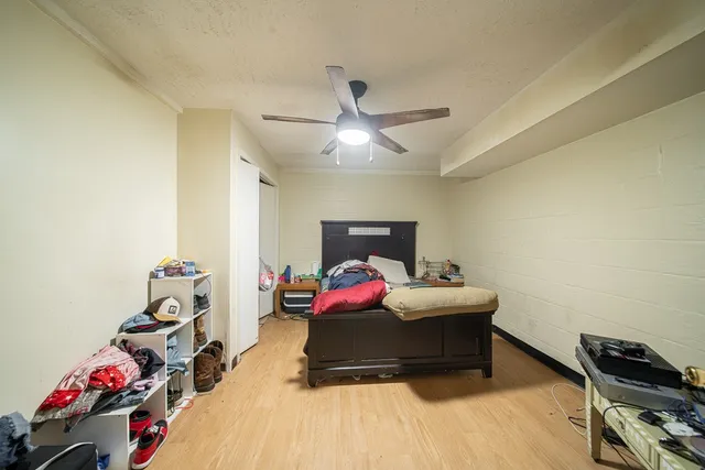 a living room with hard wood floor and gym equipment