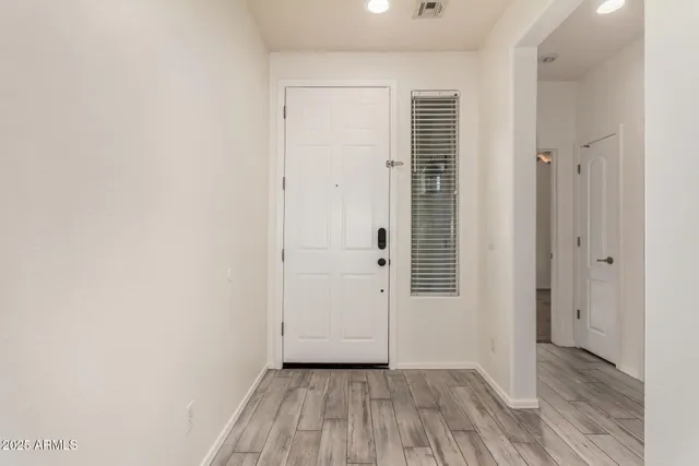 a view of a kitchen with a sink and a refrigerator
