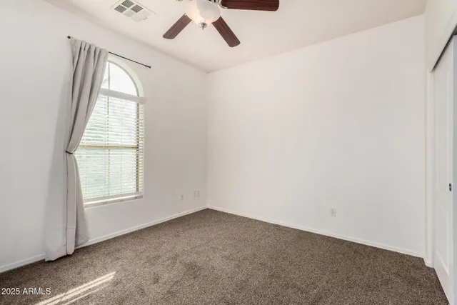 a large kitchen with cabinets and stainless steel appliances