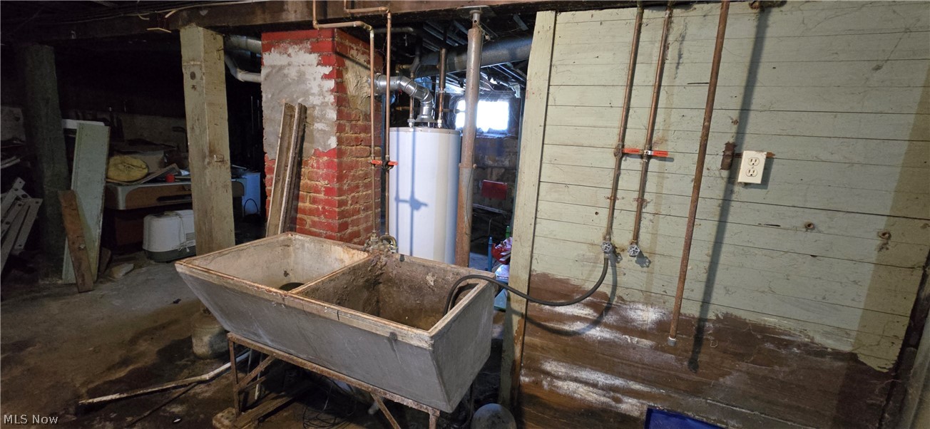 1706 Hampton Road Akron, OH 44305 - Photo 18 of 28 Basement hot water tank and utility sink / laundry area