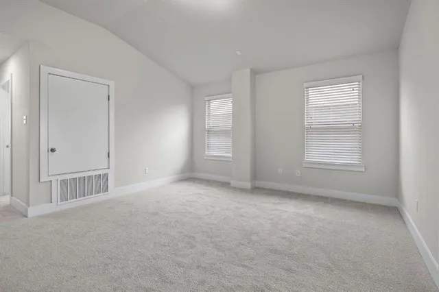a view of empty room with windows