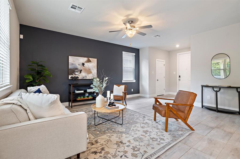 3605 Talladega Trace Austin, TX 78728 - Photo 3 of 27 a living room with furniture and a chandelier