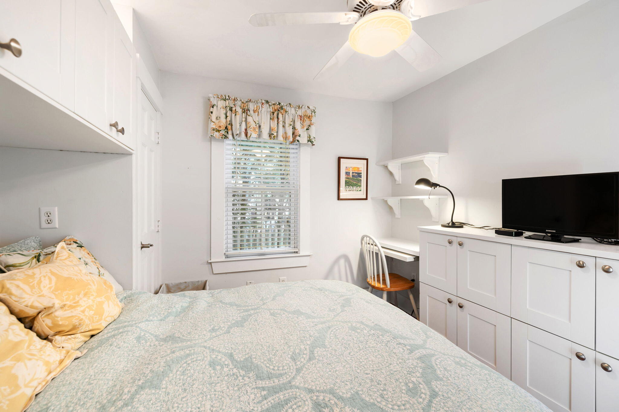 176 Commercial Street, Unit U2 Provincetown, MA 02657 - Photo 20 of 29 a bedroom with a bed and a flat screen tv
