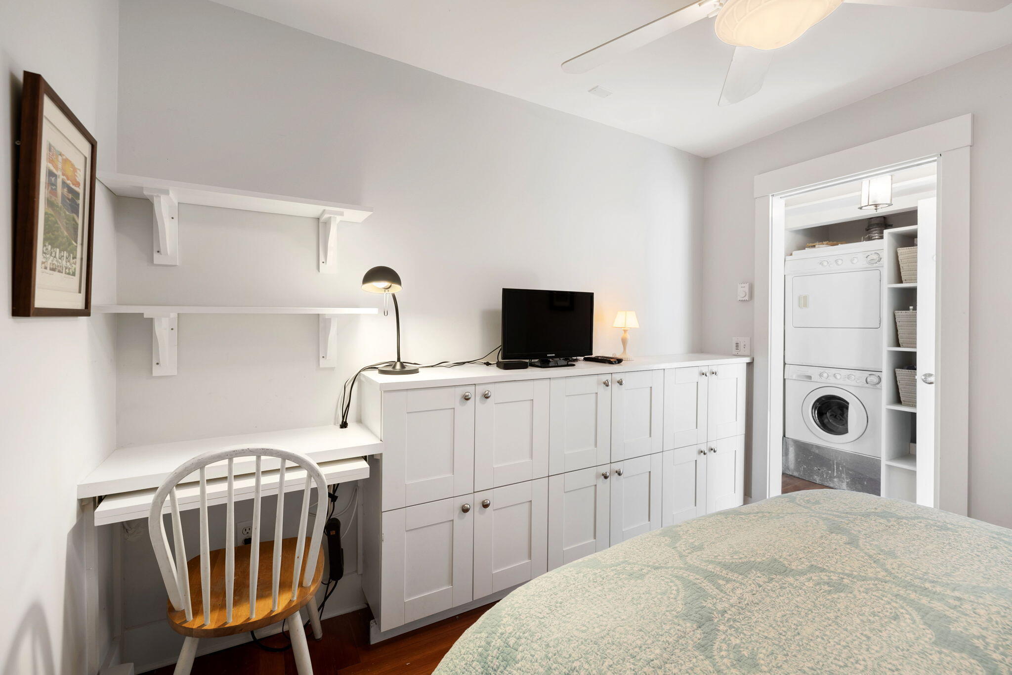 176 Commercial Street, Unit U2 Provincetown, MA 02657 - Photo 21 of 29 a view of a bedroom with a bed and a flat tv screen