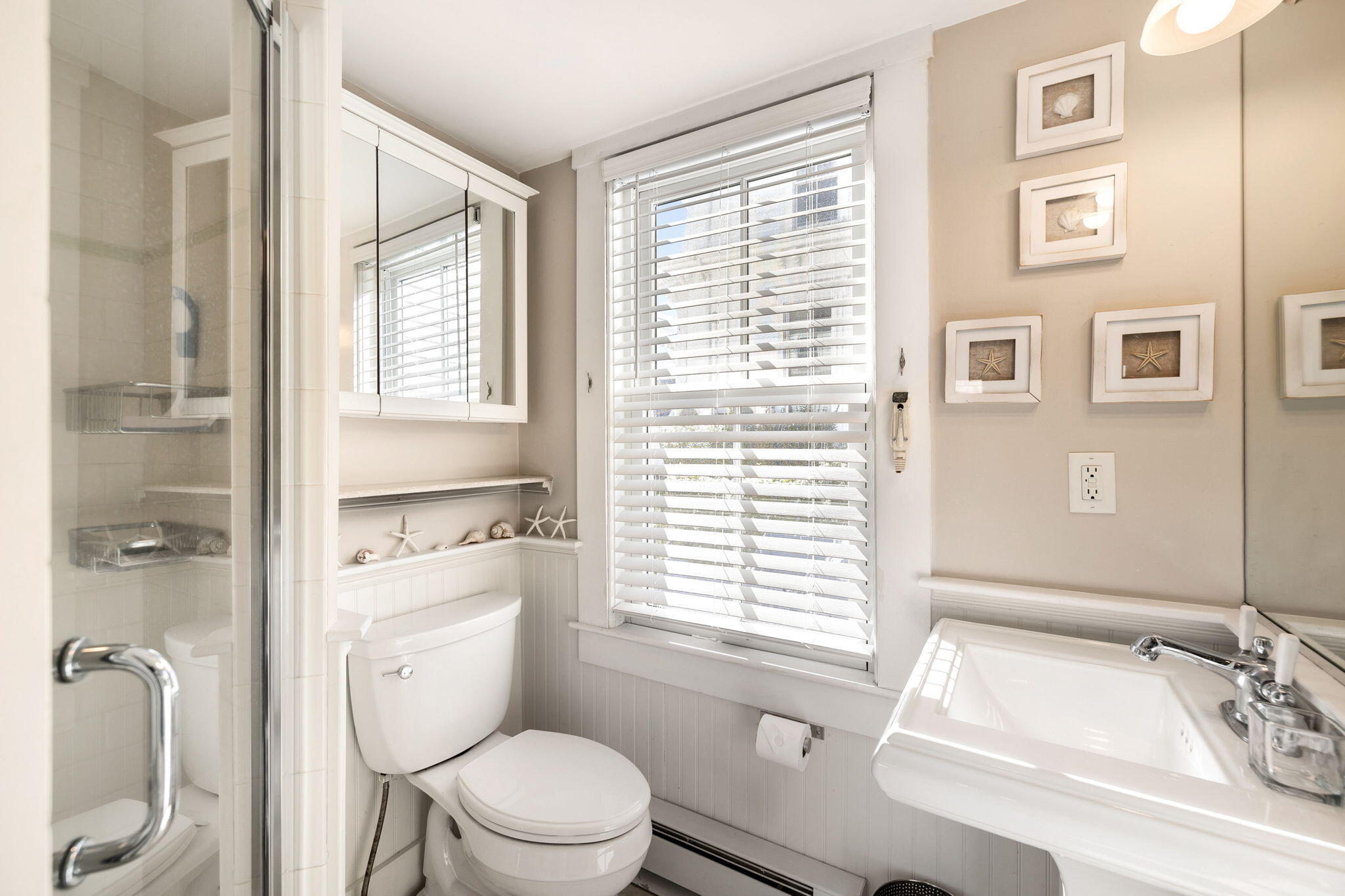 176 Commercial Street, Unit U2 Provincetown, MA 02657 - Photo 23 of 29 a bathroom with a sink a toilet and a shower