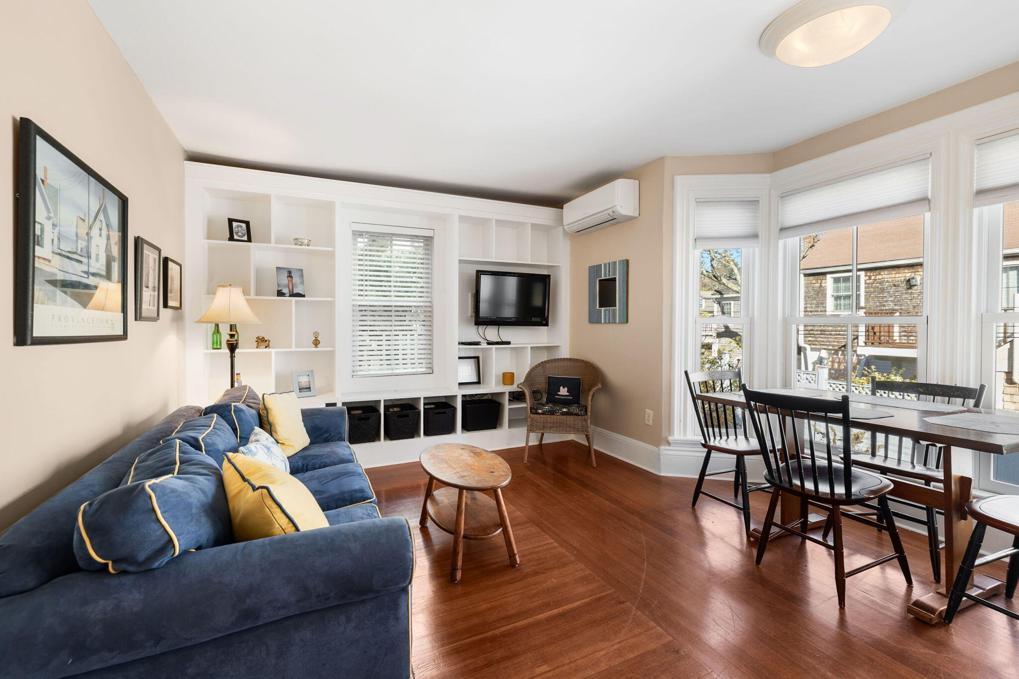 176 Commercial Street, Unit U2 Provincetown, MA 02657 - Photo 5 of 29 a living room with furniture and a flat screen tv