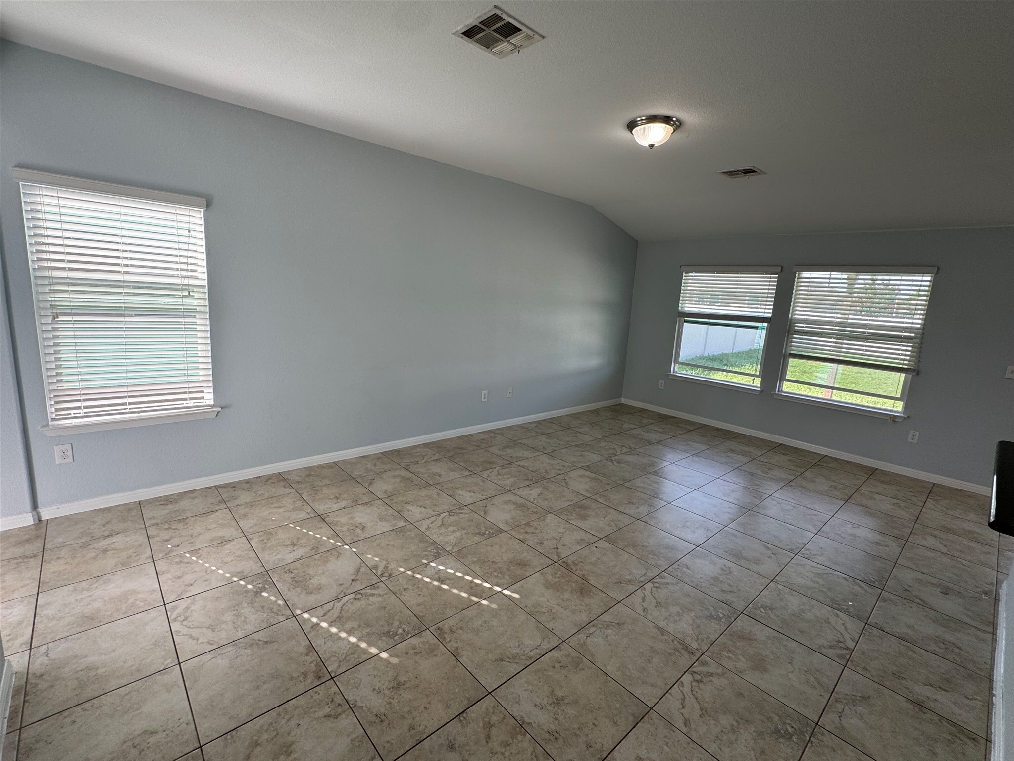 1520 Portchester Castle Path Pflugerville, TX 78660 - Photo 3 of 26 Naturally illuminated interiors boast tiled flooring and ample natural light through well-placed windows.