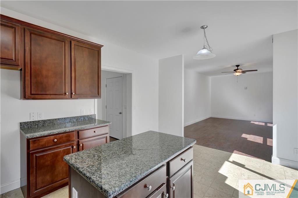 11 Addison Road Howell, NJ 07731 - Photo 11 of 25 a kitchen with granite countertop cabinets and window